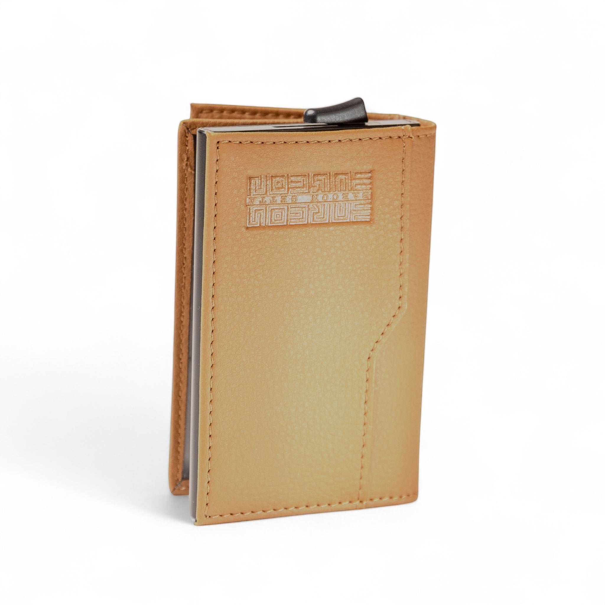Barcon Getta Inc minimalist card holder wallet in tan full grain leather with embossed logo and card mechanism.