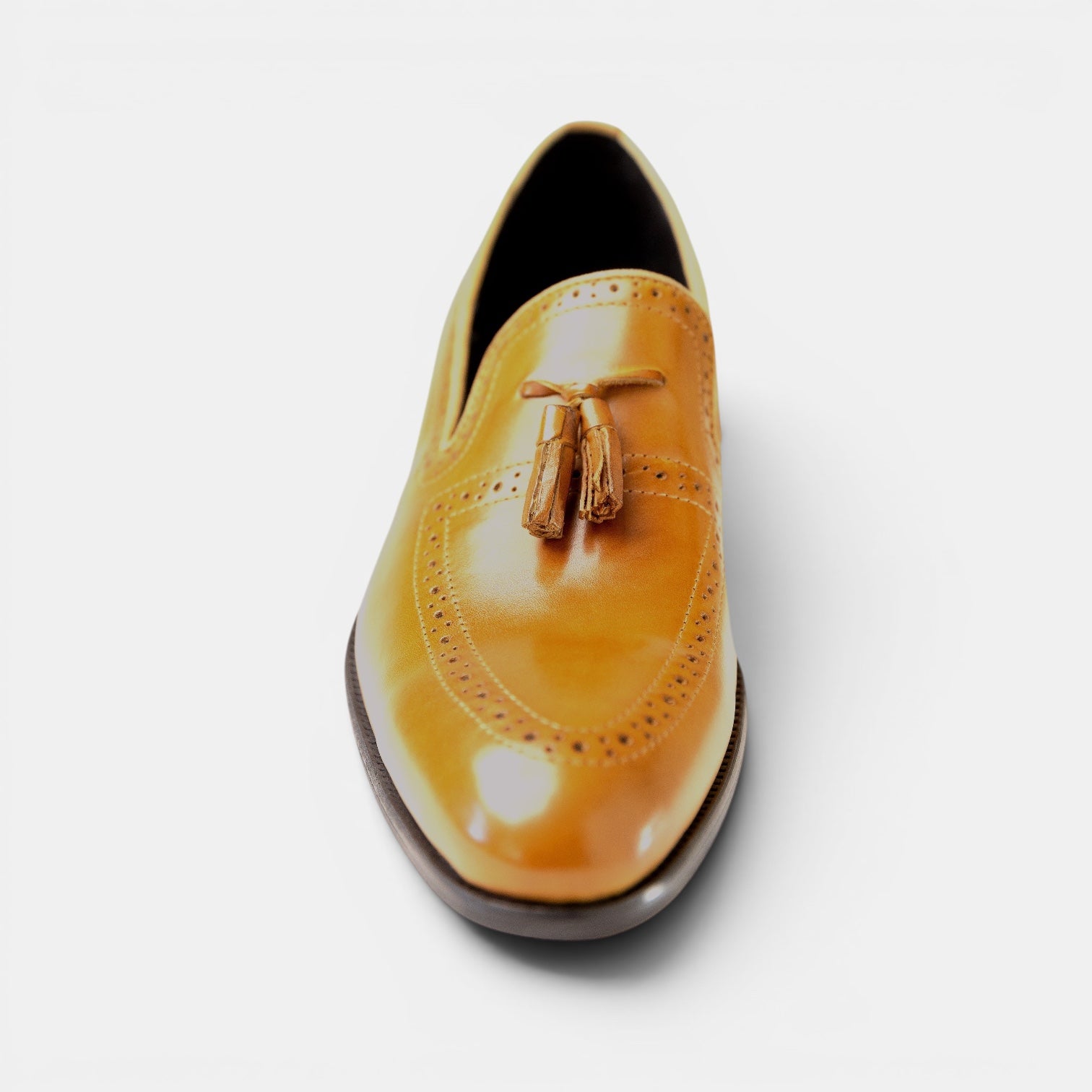Barcon Getta Inc NEGA tassel loafer in warm tan full-grain leather with full brogue detailing and a slightly pointed toe.