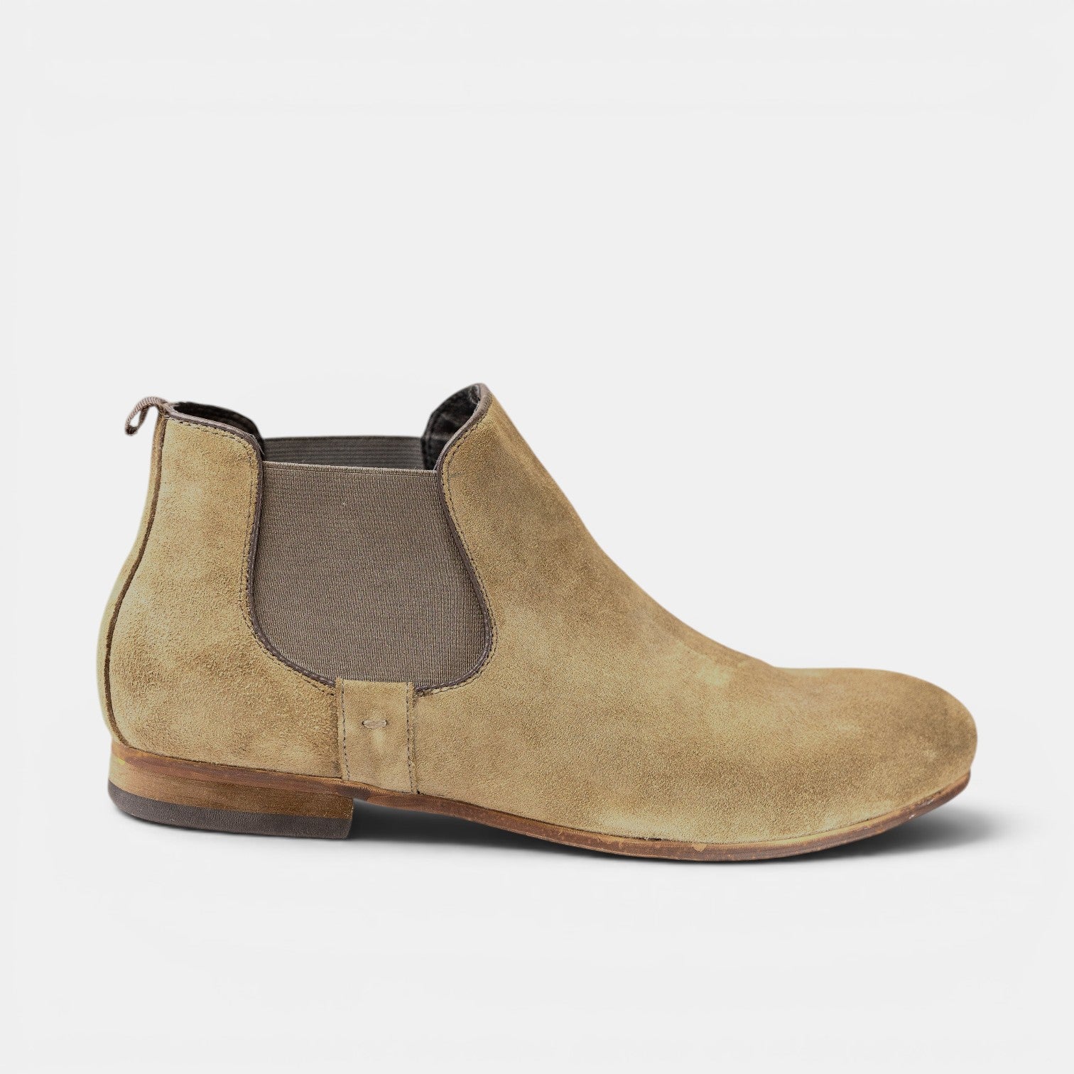 Barcon Getta Inc tan suede Chelsea boots with elastic side panels and a pull tab. Handmade from Ethiopian leather.