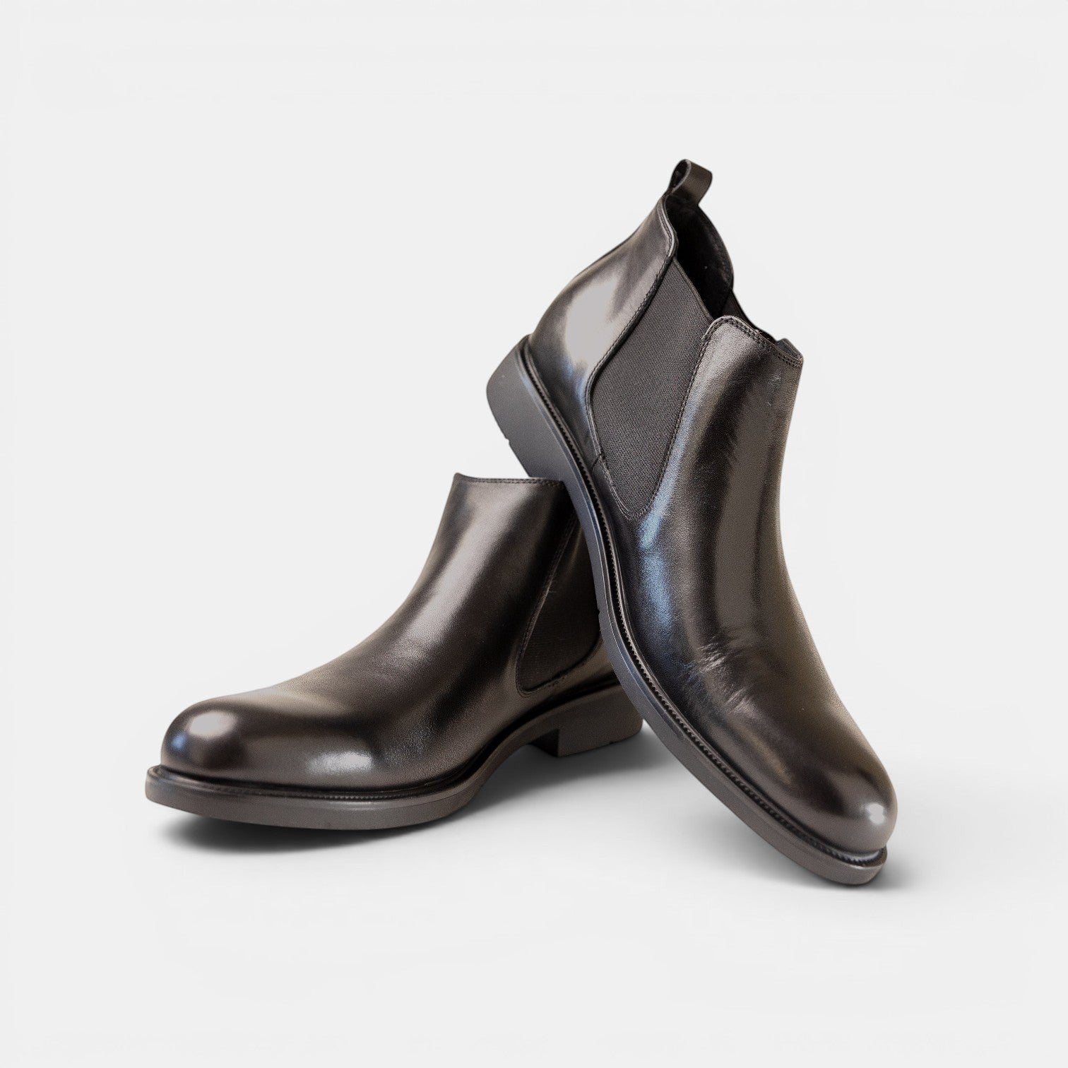 Barcon Getta Inc ACCRA Chelsea Boots in black leather with elastic side panels and durable sole.