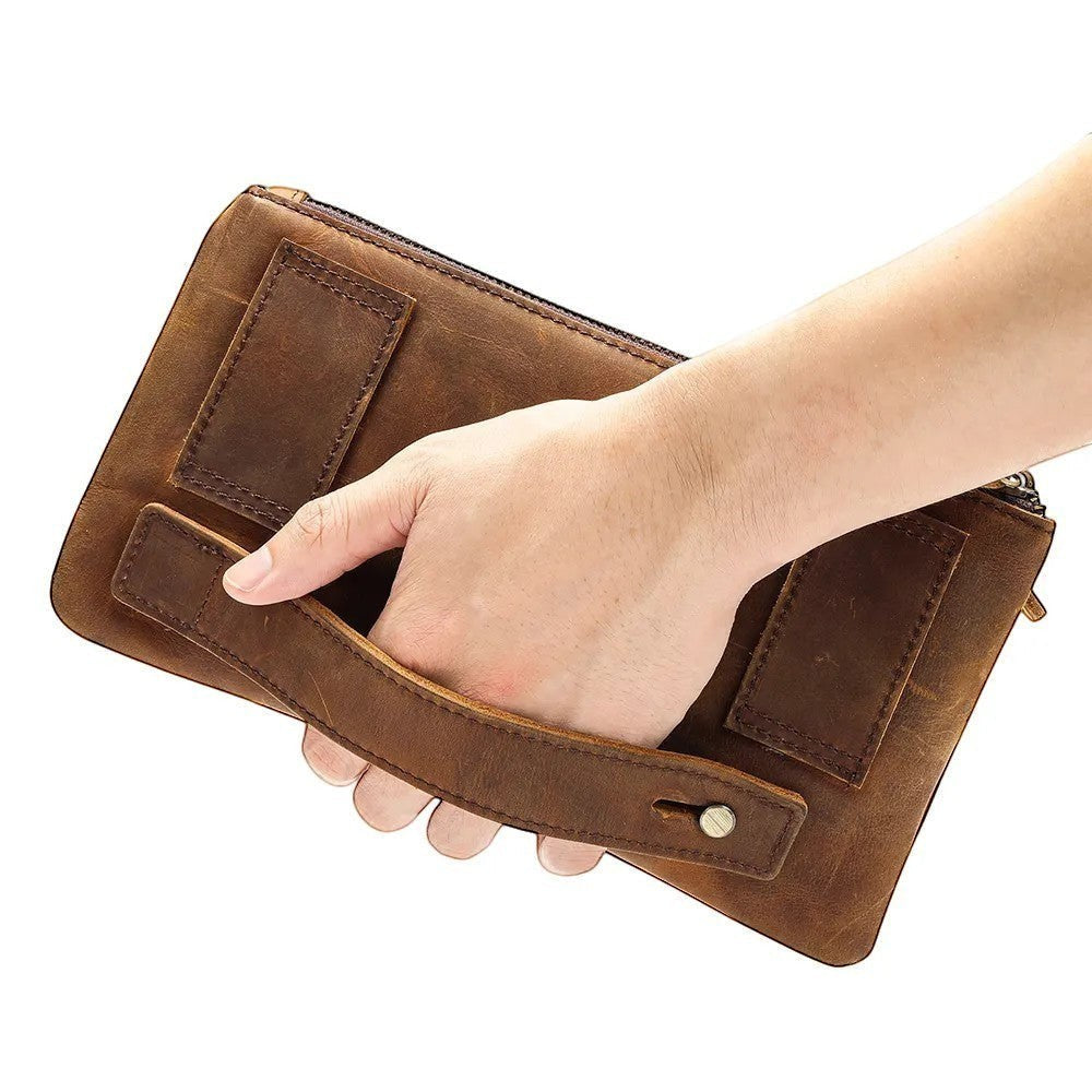 Barcon Getta Inc brown full grain leather fanny bag with multiple pockets and a wrist strap.