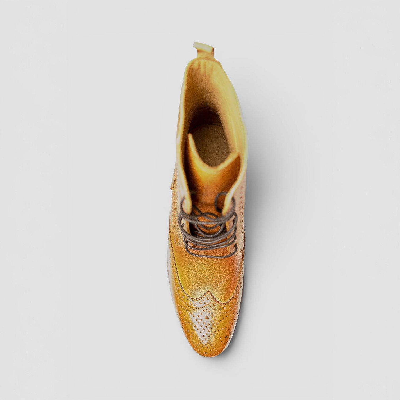 Barcon Getta Inc NAIROBI tan leather wingtip lace-up boots with brogue detailing.