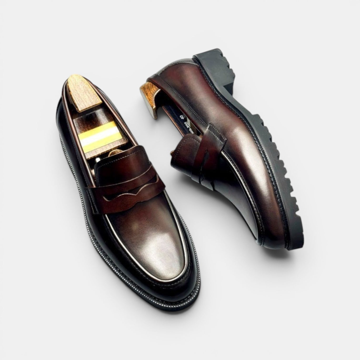 Barcon Getta Inc NIAMEY Penny Loafer in polished brown leather with a lug sole and classic strap detail.