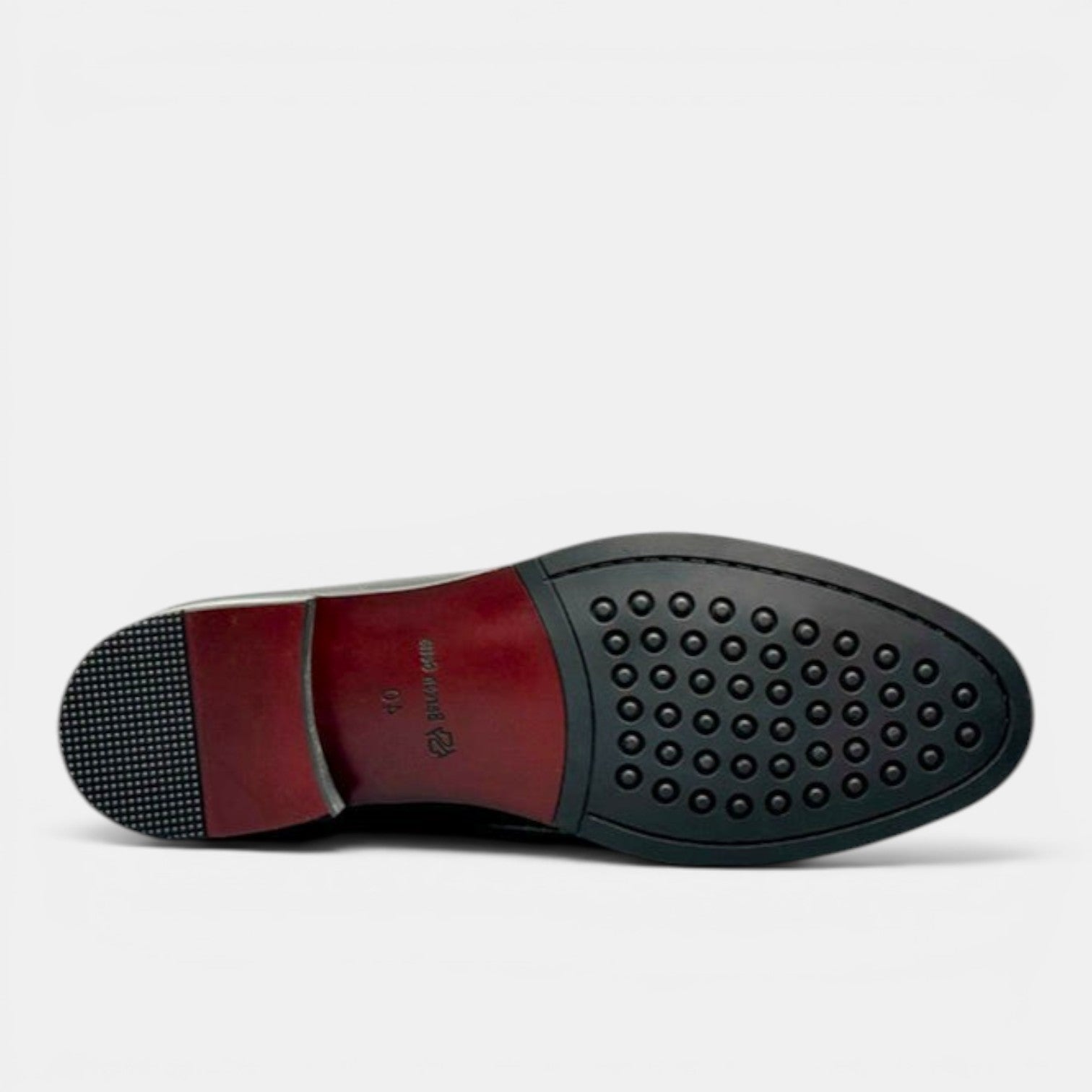 Barcon Getta Inc RABAT black leather ankle boots sole view with textured grip and red heel.