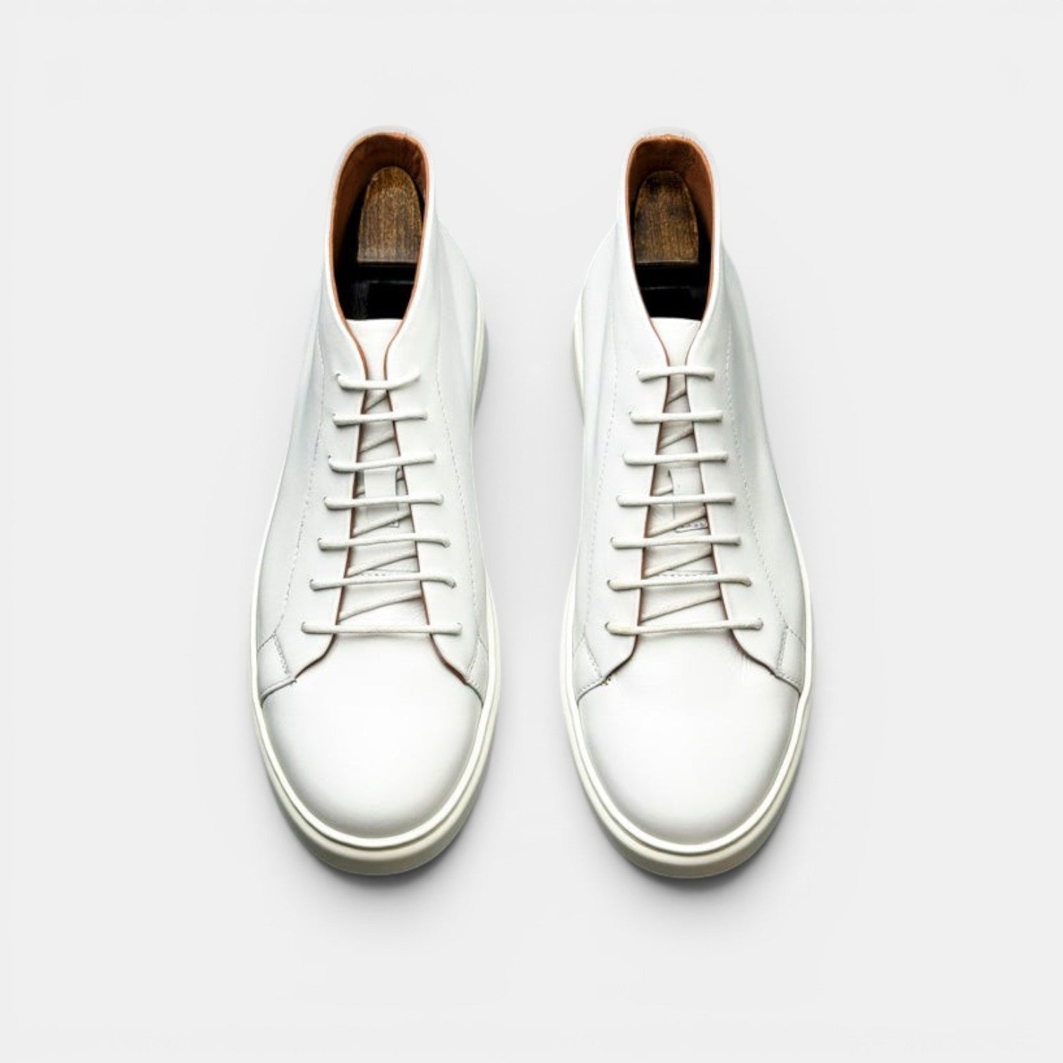 Barcon Getta Inc white leather high top sneakers with lace-up closure and durable rubber sole.