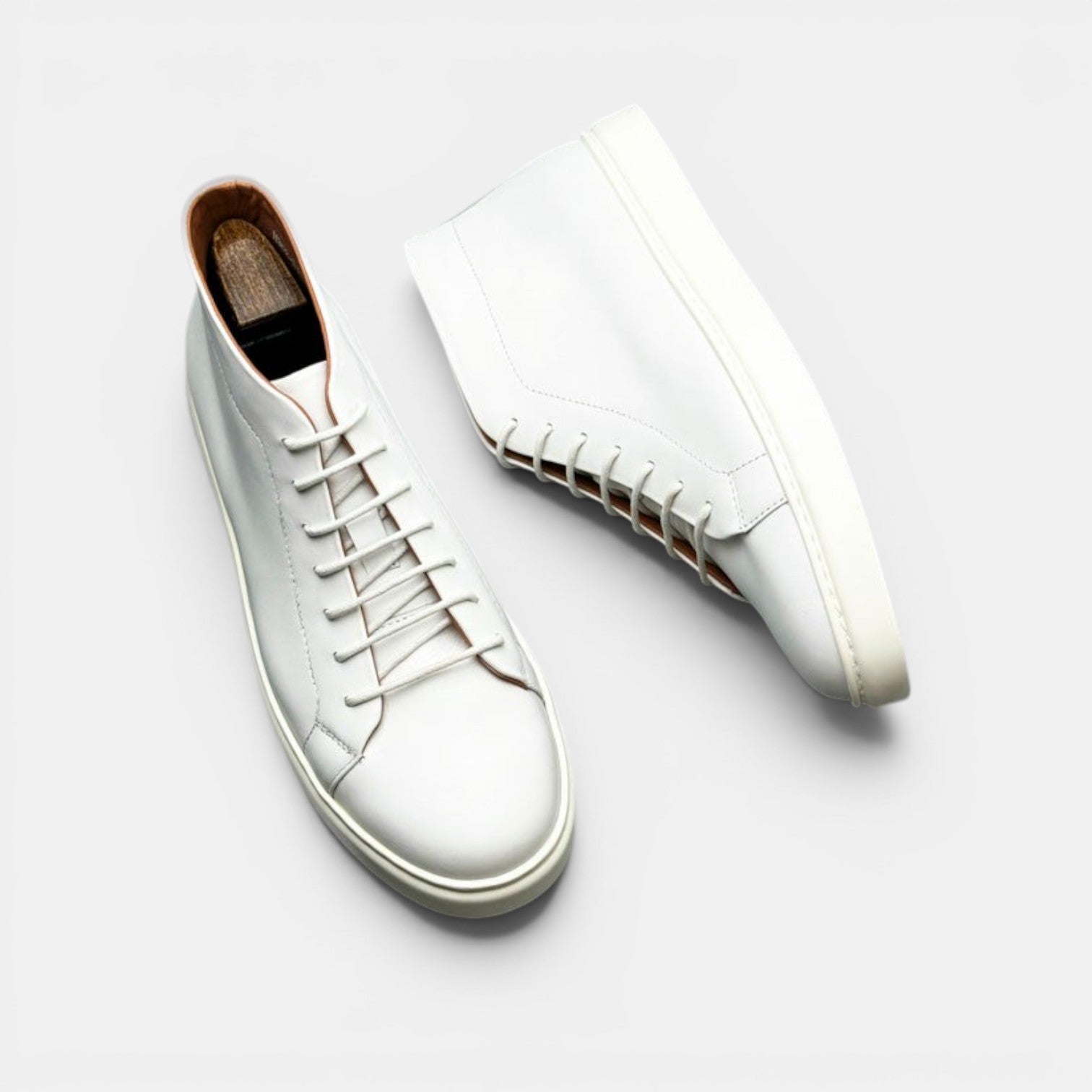 Barcon Getta Inc MEDA white leather high top sneakers with lace-up closure and durable rubber sole.