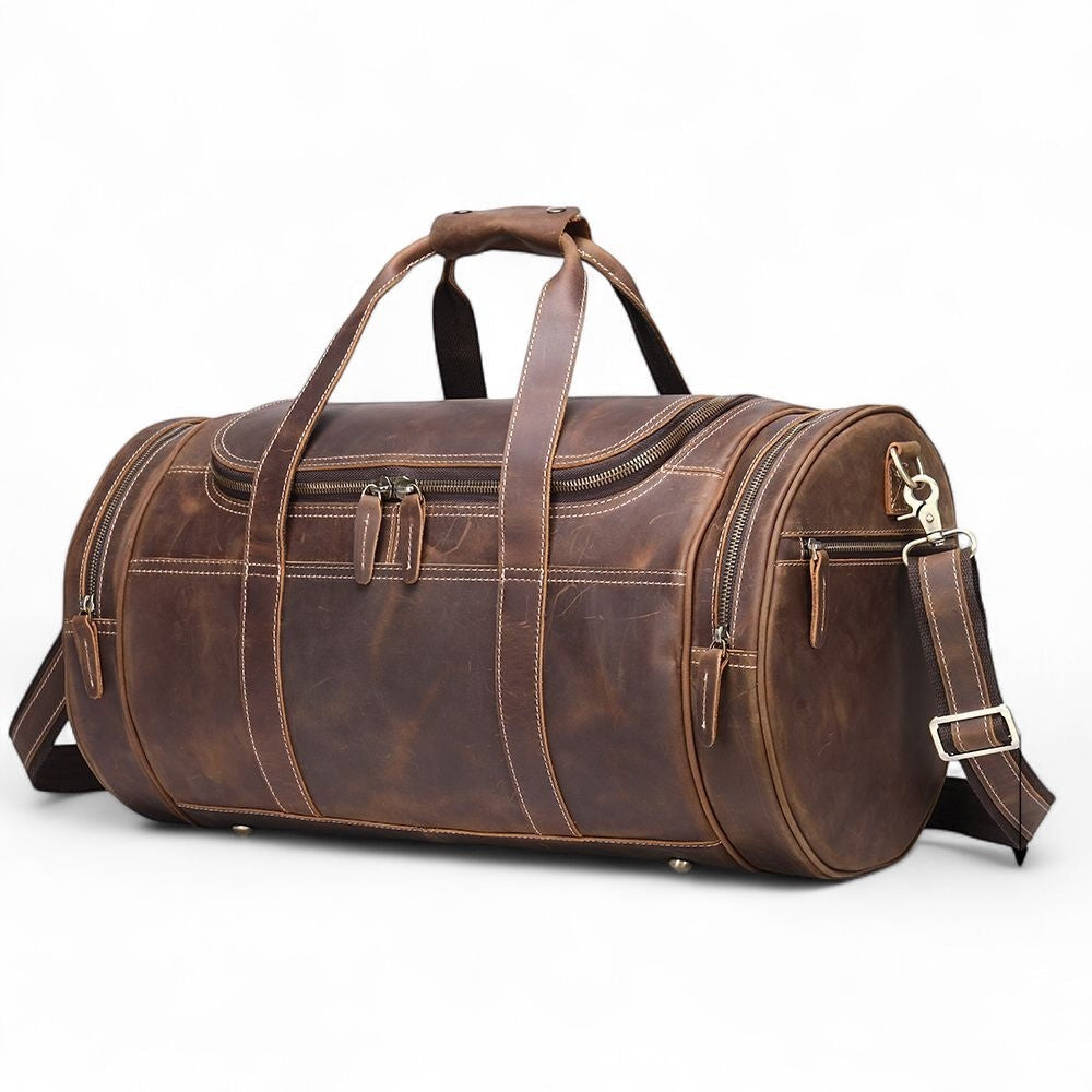 Barcon Getta Inc distressed brown full-grain leather duffel bag with contrast stitching and multiple zippered pockets.
