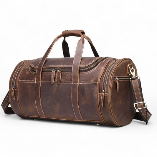 Brown leather duffel bag on a white background