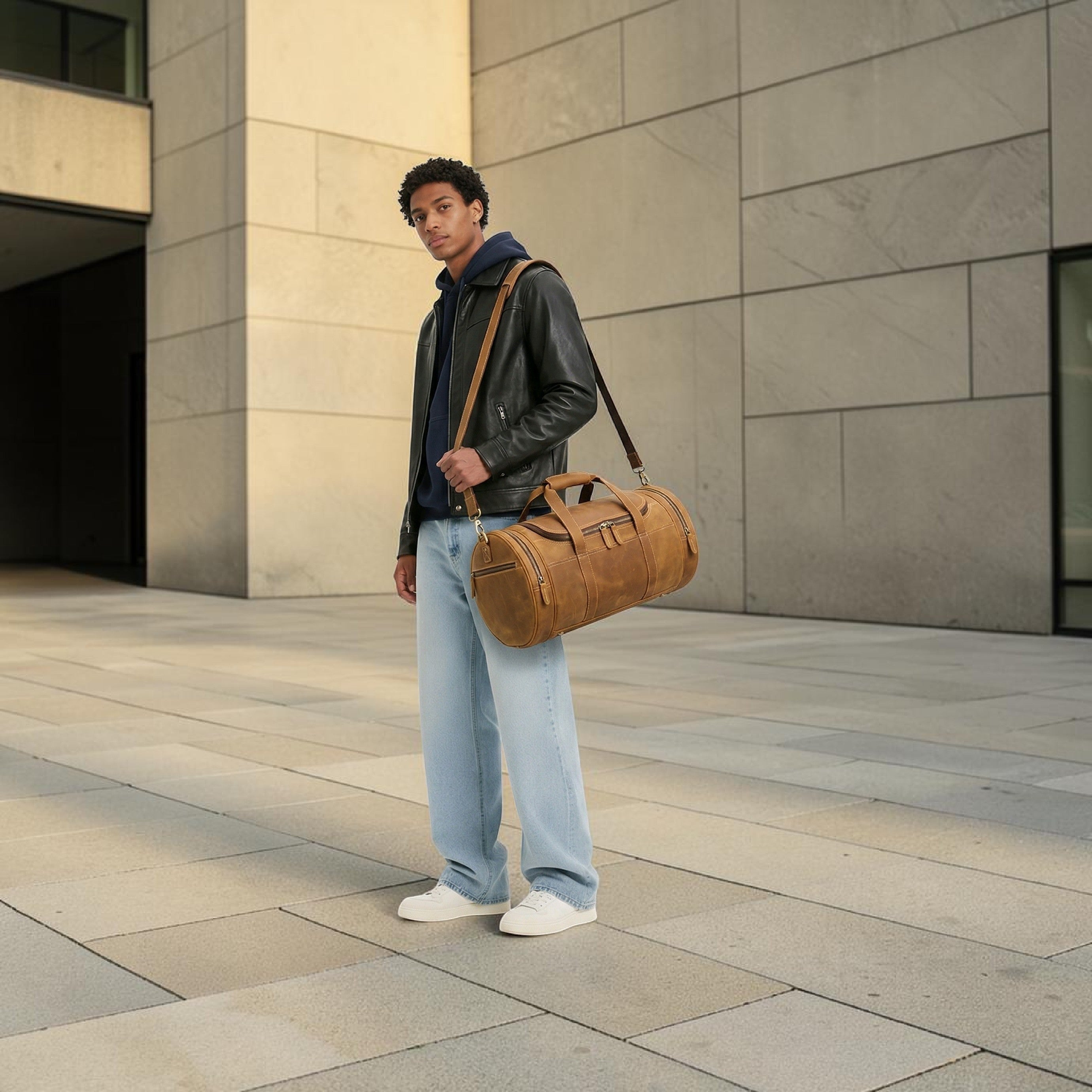 Barcon Getta Inc Navigator Duffel, distressed brown full-grain leather travel bag with contrast stitching and zippered pockets.