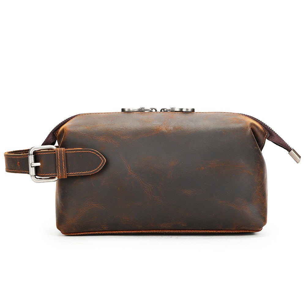 Barcon Getta Inc brown leather dopp kit with buckle strap and silver zipper. Multifunctional travel toiletry bag.