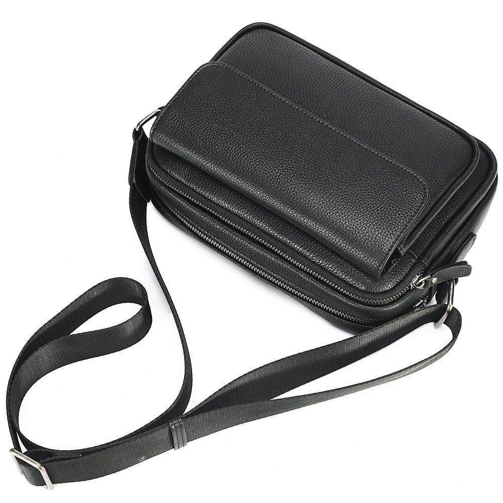 Barcon Getta Inc black full grain leather everyday sling shoulder bag with front flap and multiple zipper pockets.