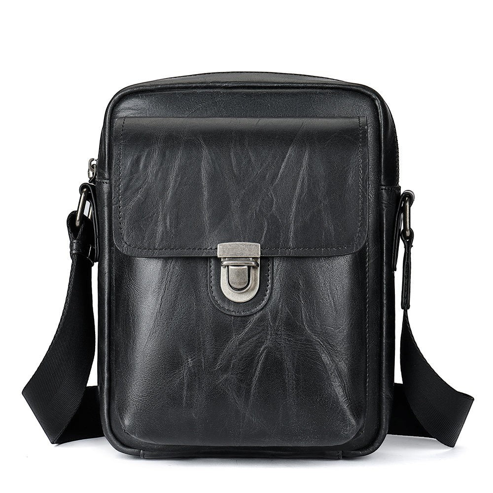 Barcon Getta Inc black full grain Ethiopian leather shoulder bag with flap closure and adjustable strap.