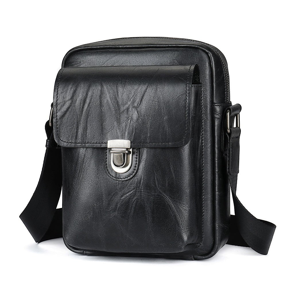 Barcon Getta Inc black Ethiopian leather shoulder bag with flap closure and silver buckle. Handmade full grain leather.