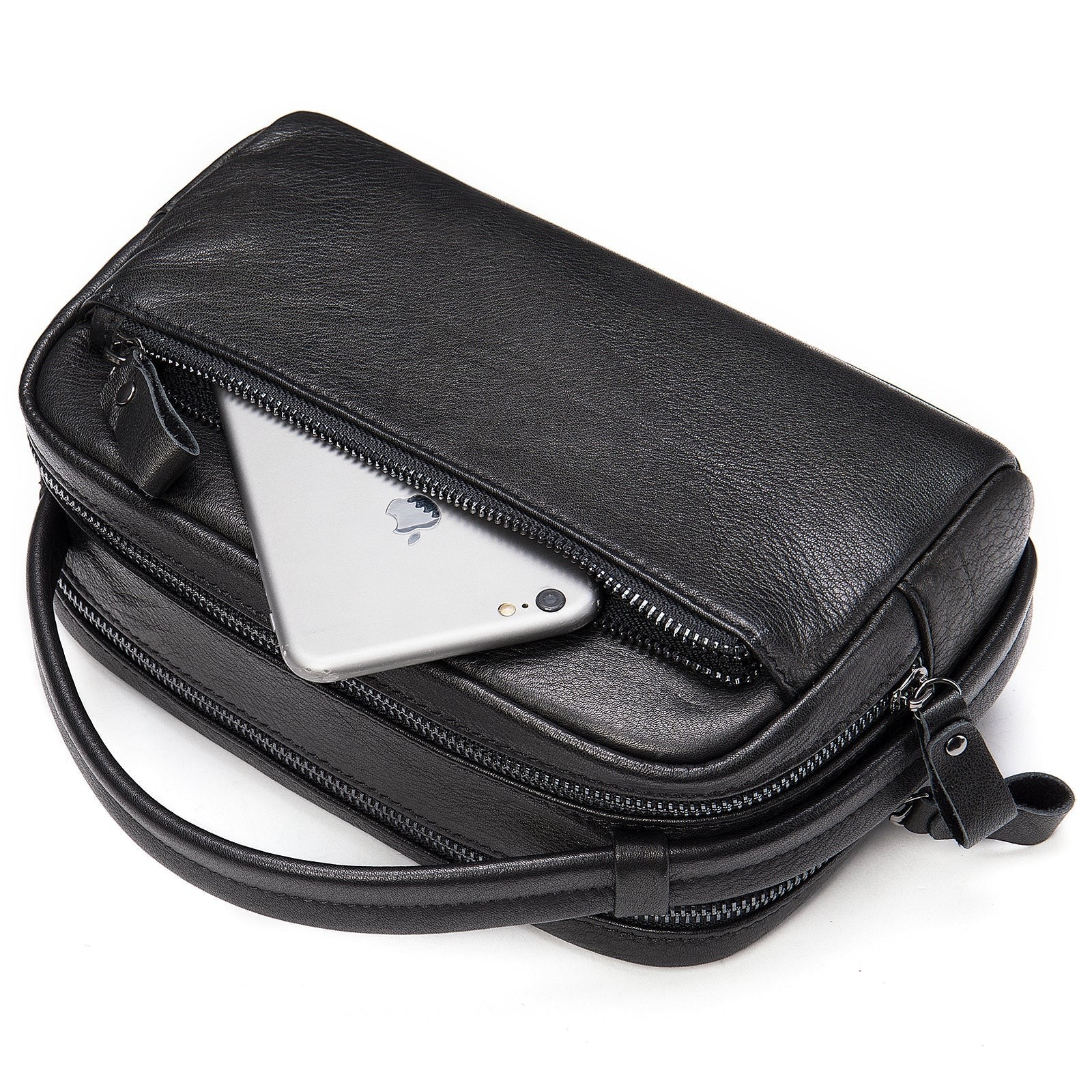 Barcon Getta Inc black leather toiletry bag with multiple zippered compartments and a side handle. A phone is shown in an outer pocket.