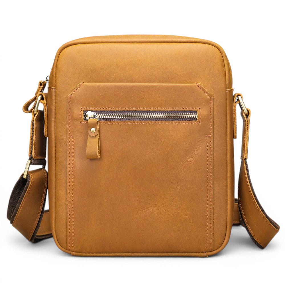 Barcon Getta Inc tan full grain leather crossbody bag with front zipper pocket and adjustable strap.