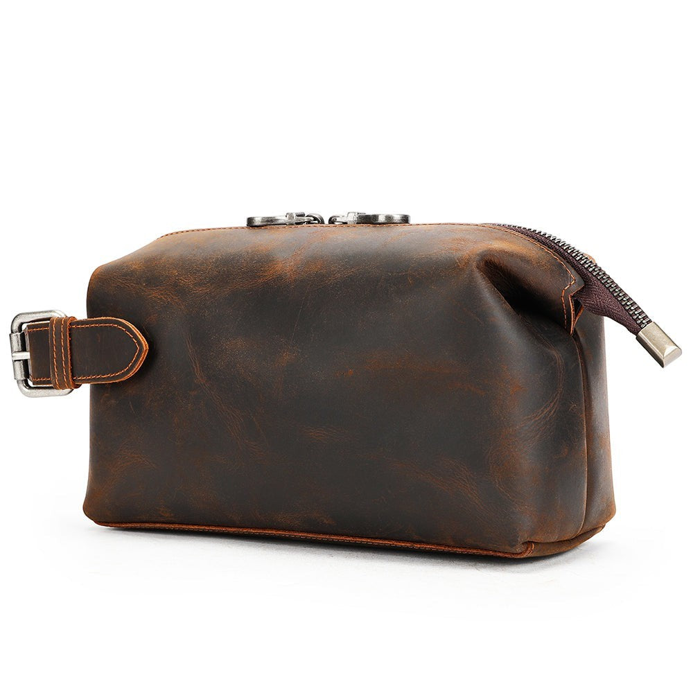 Barcon Getta Inc dark brown distressed leather dopp kit with silver zipper and buckle detail.