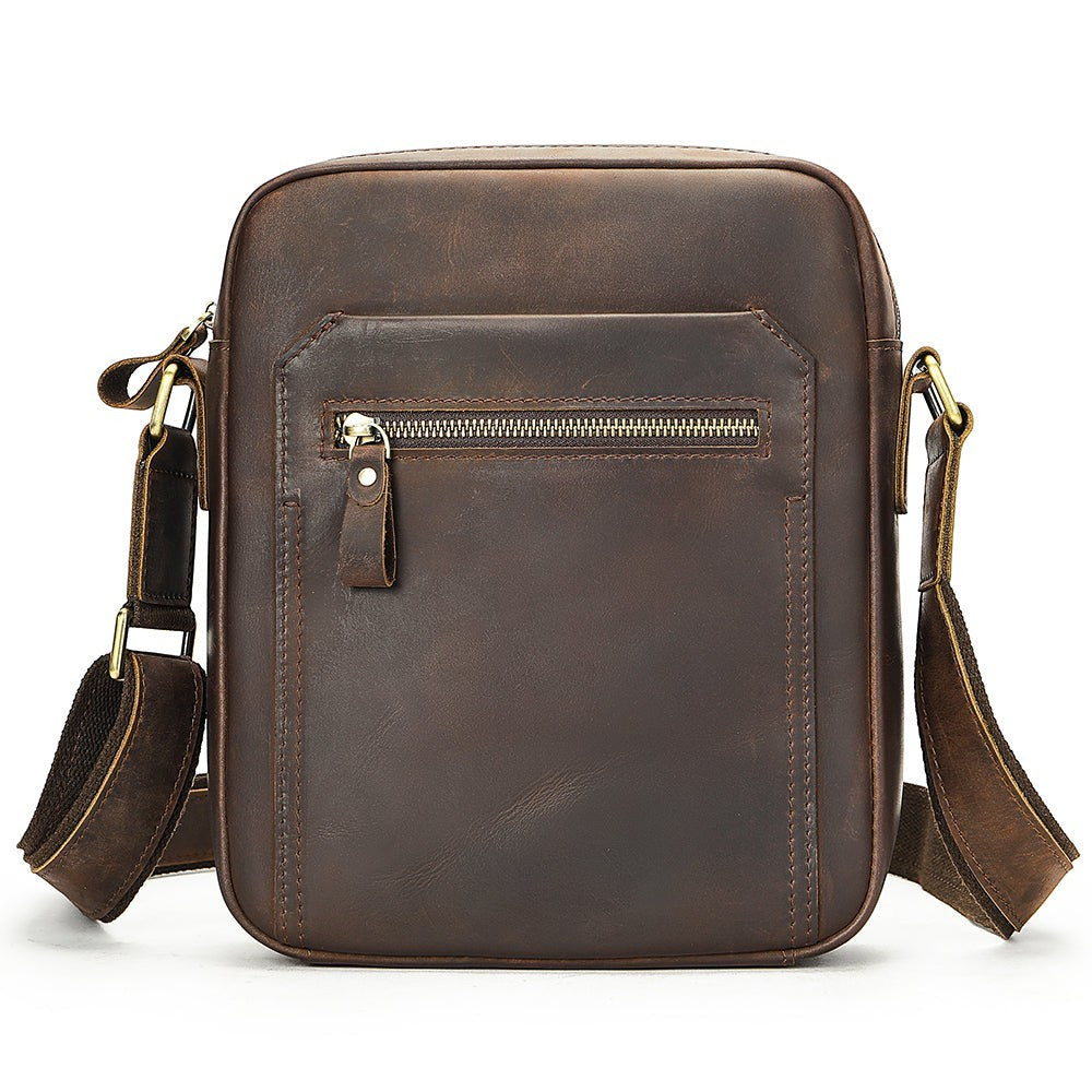 Barcon Getta Inc dark brown full grain leather crossbody bag with multiple pockets and adjustable strap.
