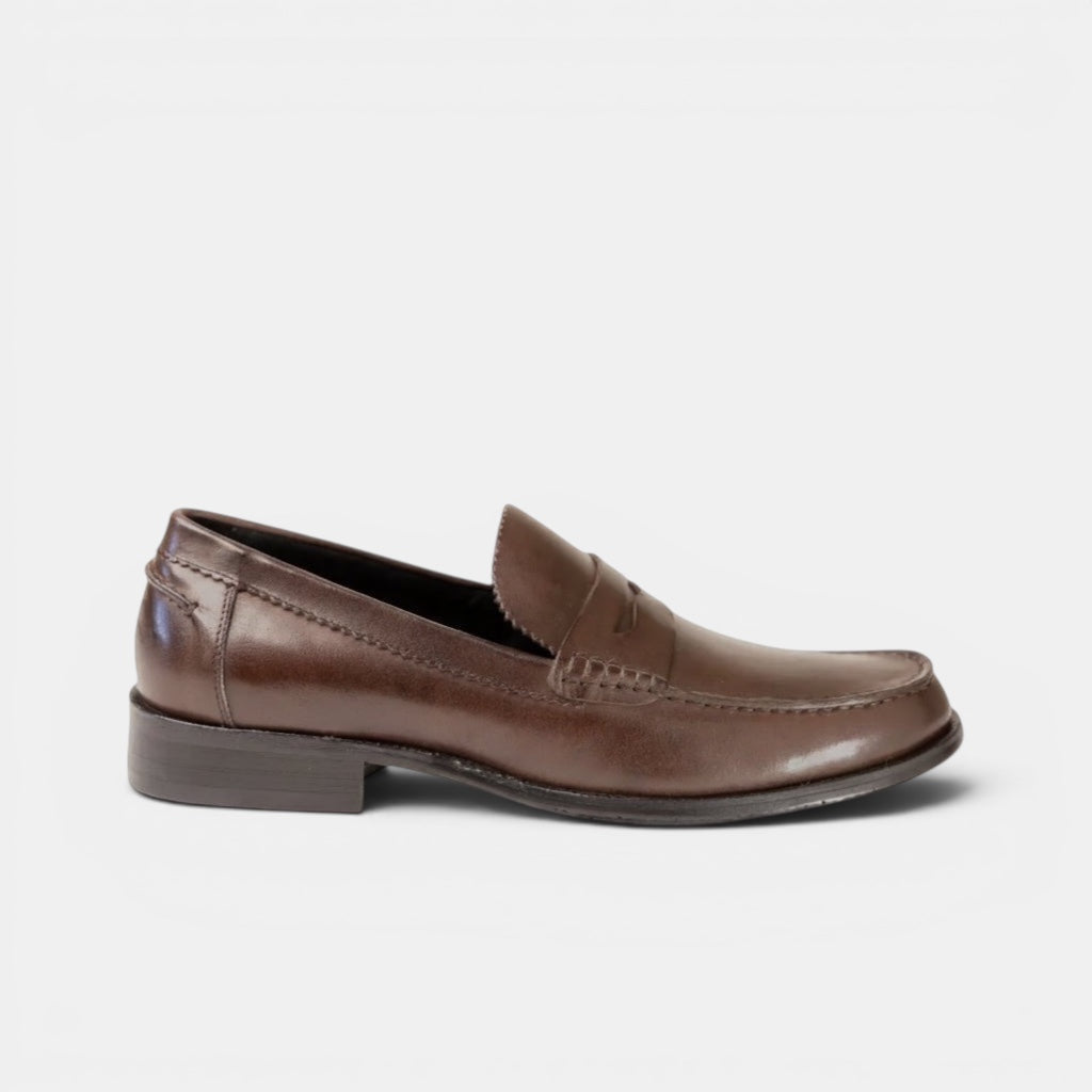Barcon Getta Inc ABUJA brown leather penny loafer with a sleek silhouette and traditional penny strap detailing.
