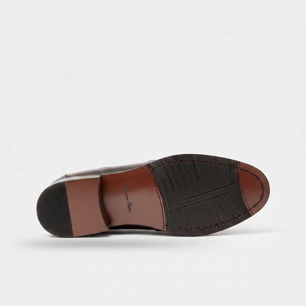 Barcon Getta Inc ABUJA Penny Loafer in dark brown leather with traditional penny strap detail and durable sole.