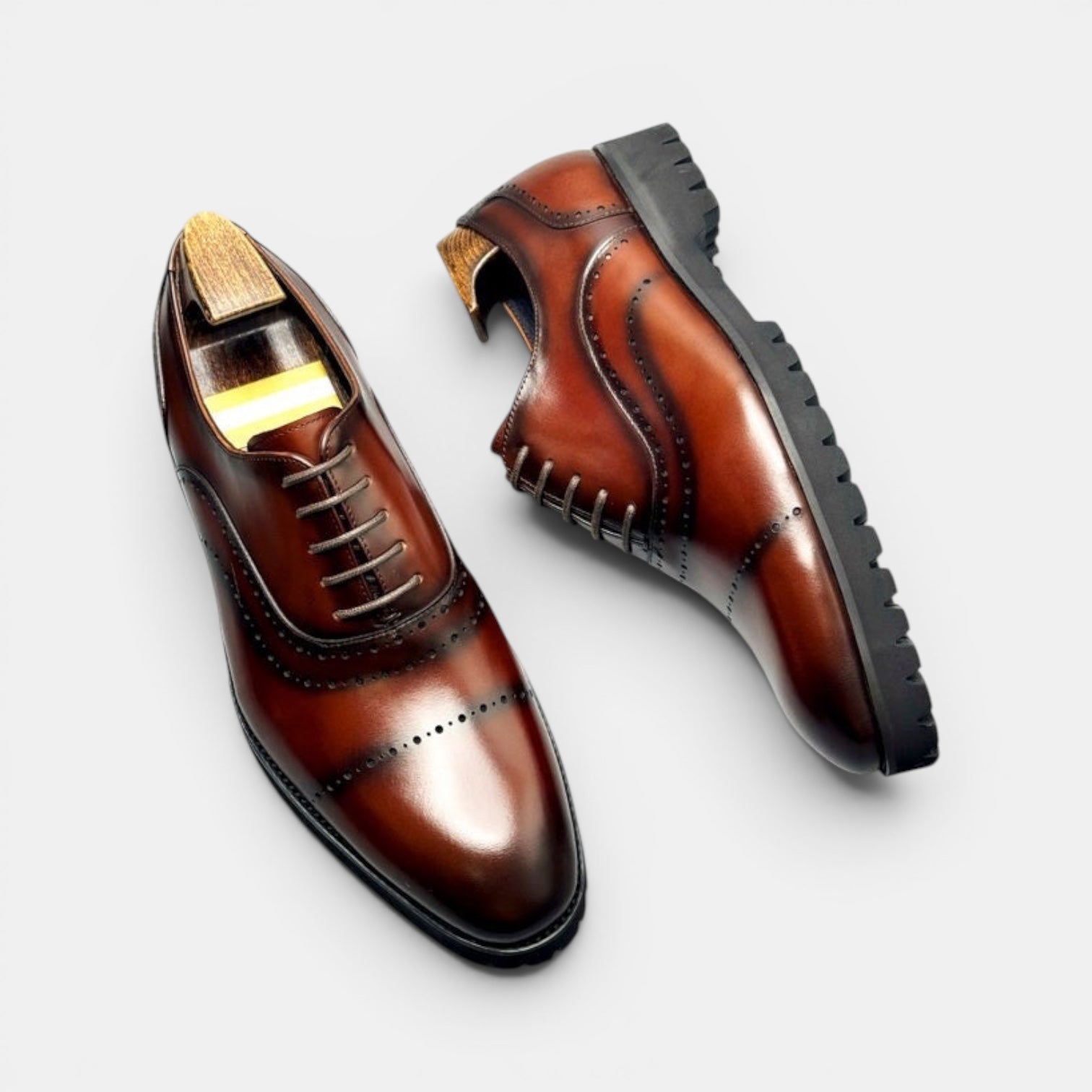 Barcon Getta Inc BANJUL cognac brown full grain leather wingtip oxford dress shoes with lug sole.
