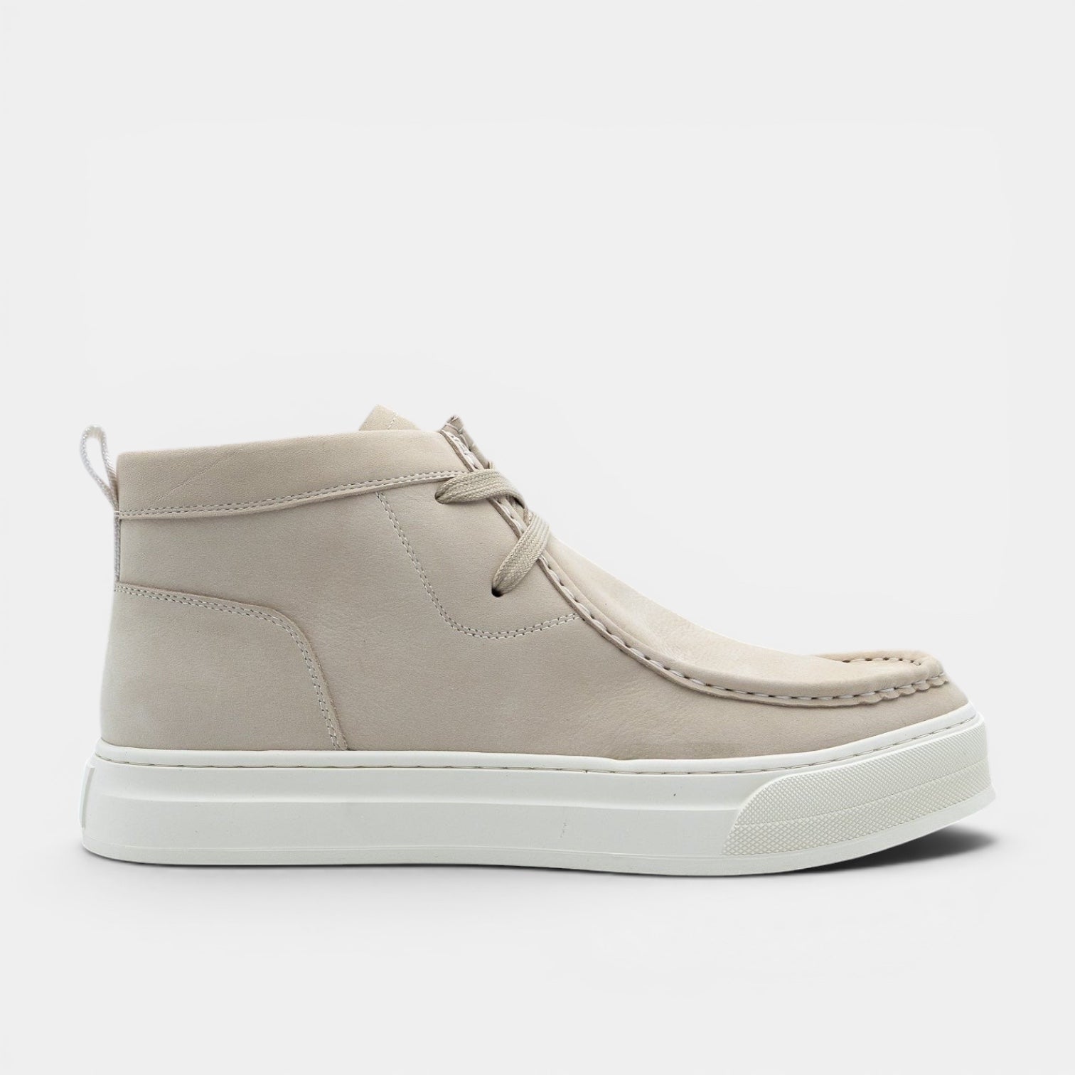 Barcon Getta Inc beige suede chukka boots with white rubber sole and lace-up closure.
