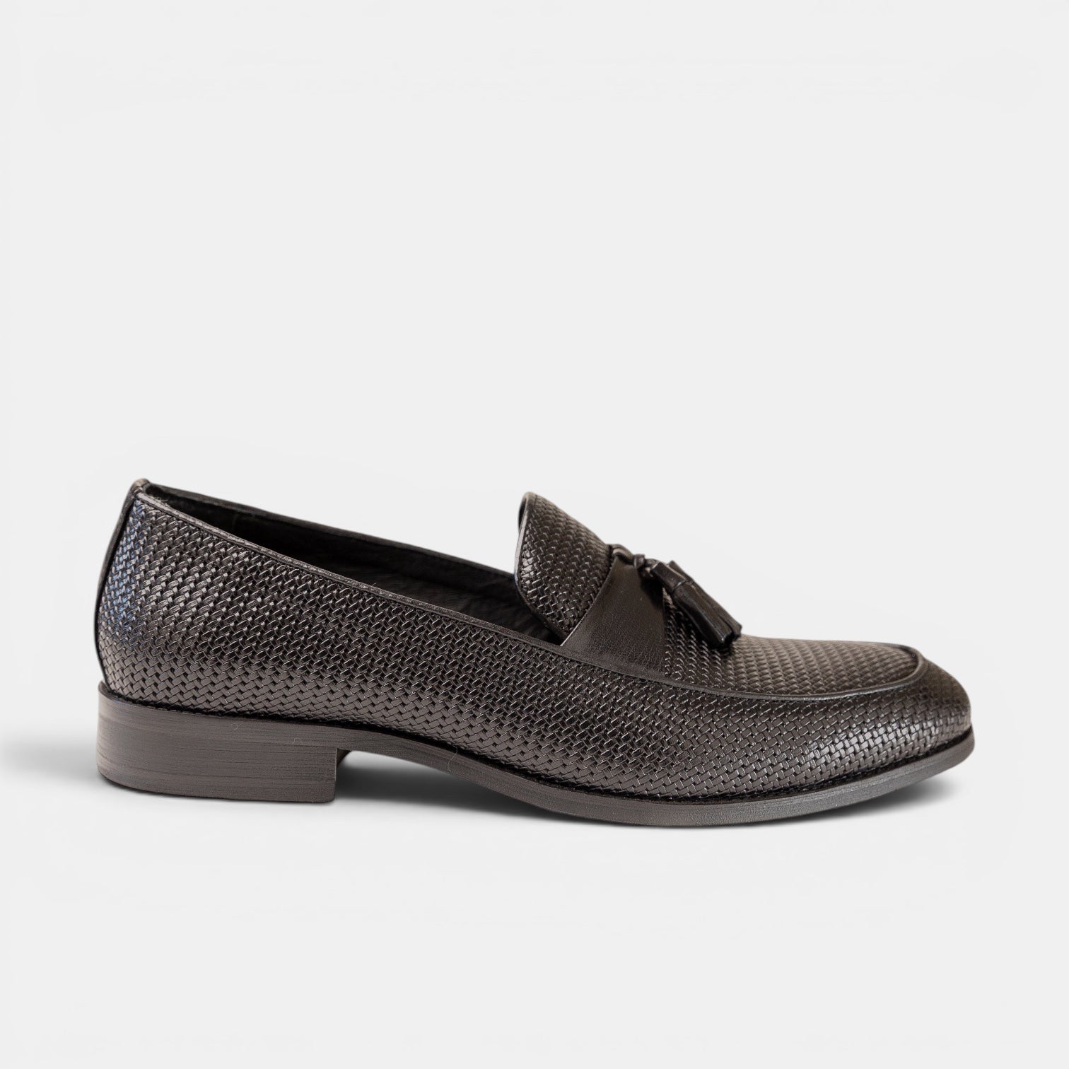 Barcon Getta Inc BERBERA black full-grain leather hand-woven tassel loafer with smooth leather saddle strap.