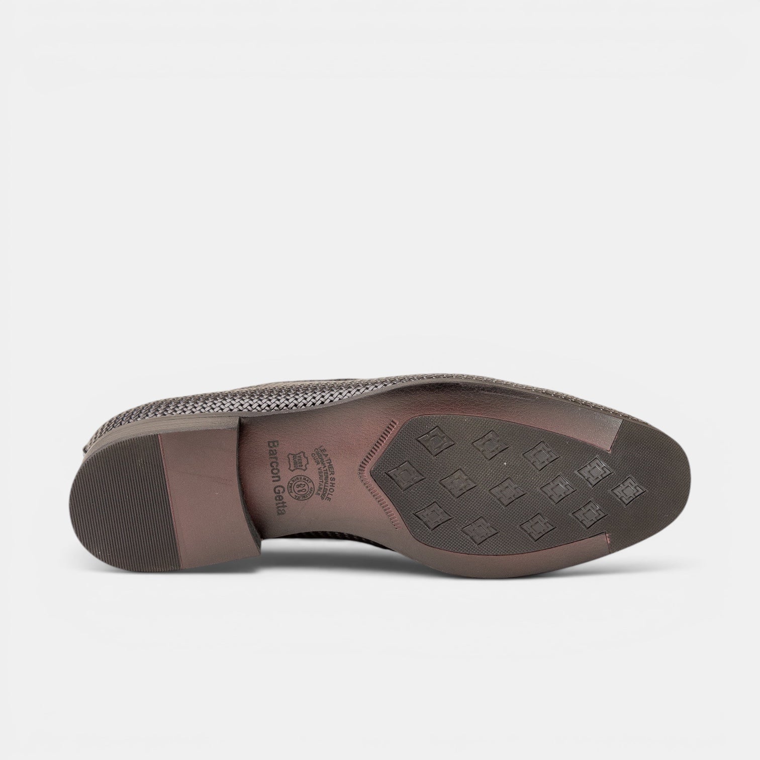 Barcon Getta Inc BERBERA burnished tan/cognac full-grain leather hand-woven tassel loafer with rubber sole.