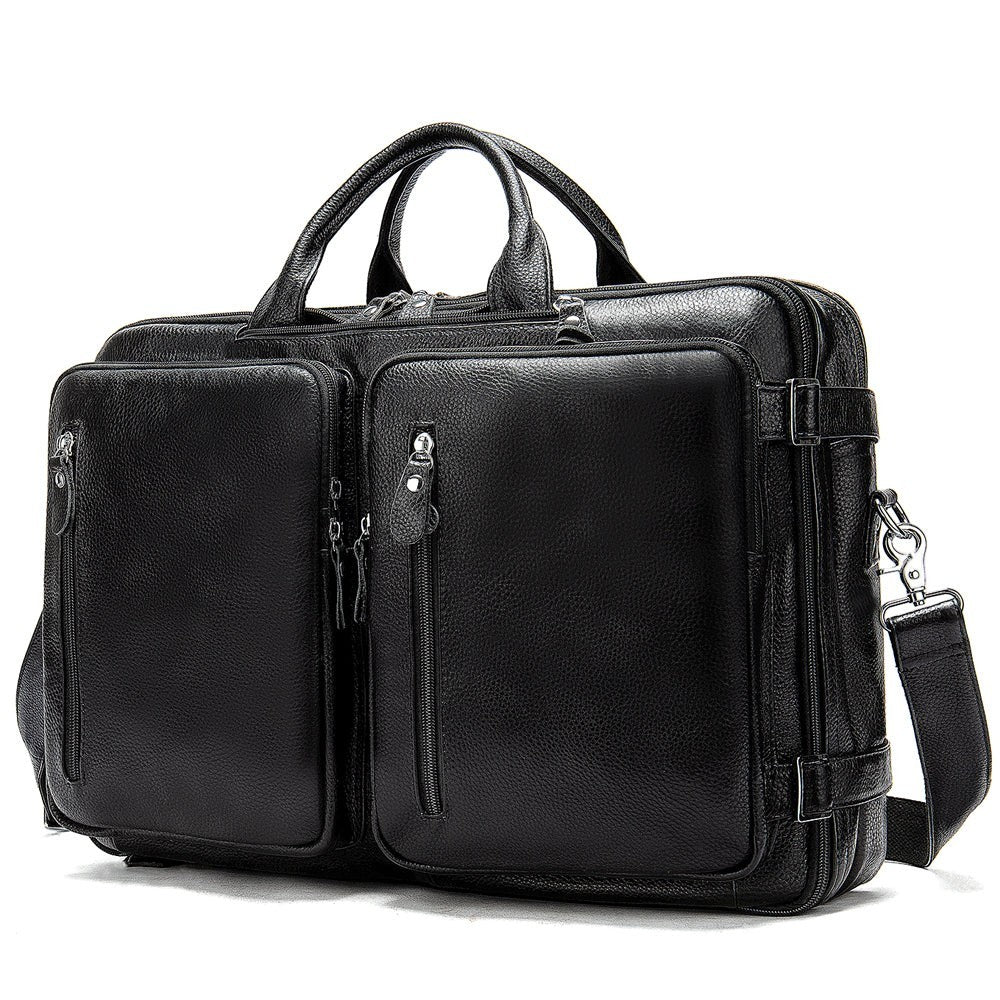 Barcon Getta Inc black textured leather briefcase with dual compartments and front zippered pockets.