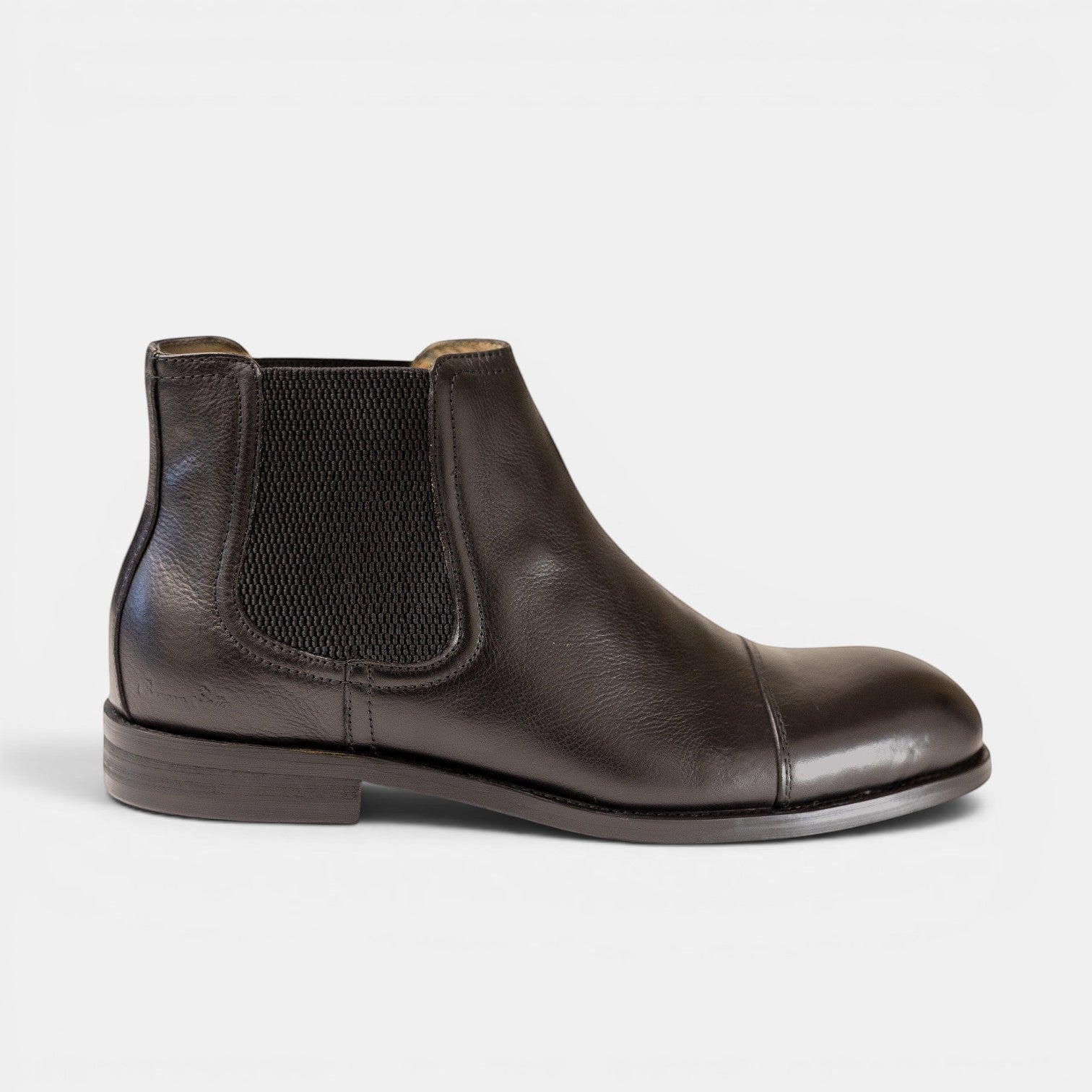 Barcon Getta Inc black full grain leather chelsea boots with elastic side panels and cap toe detail.