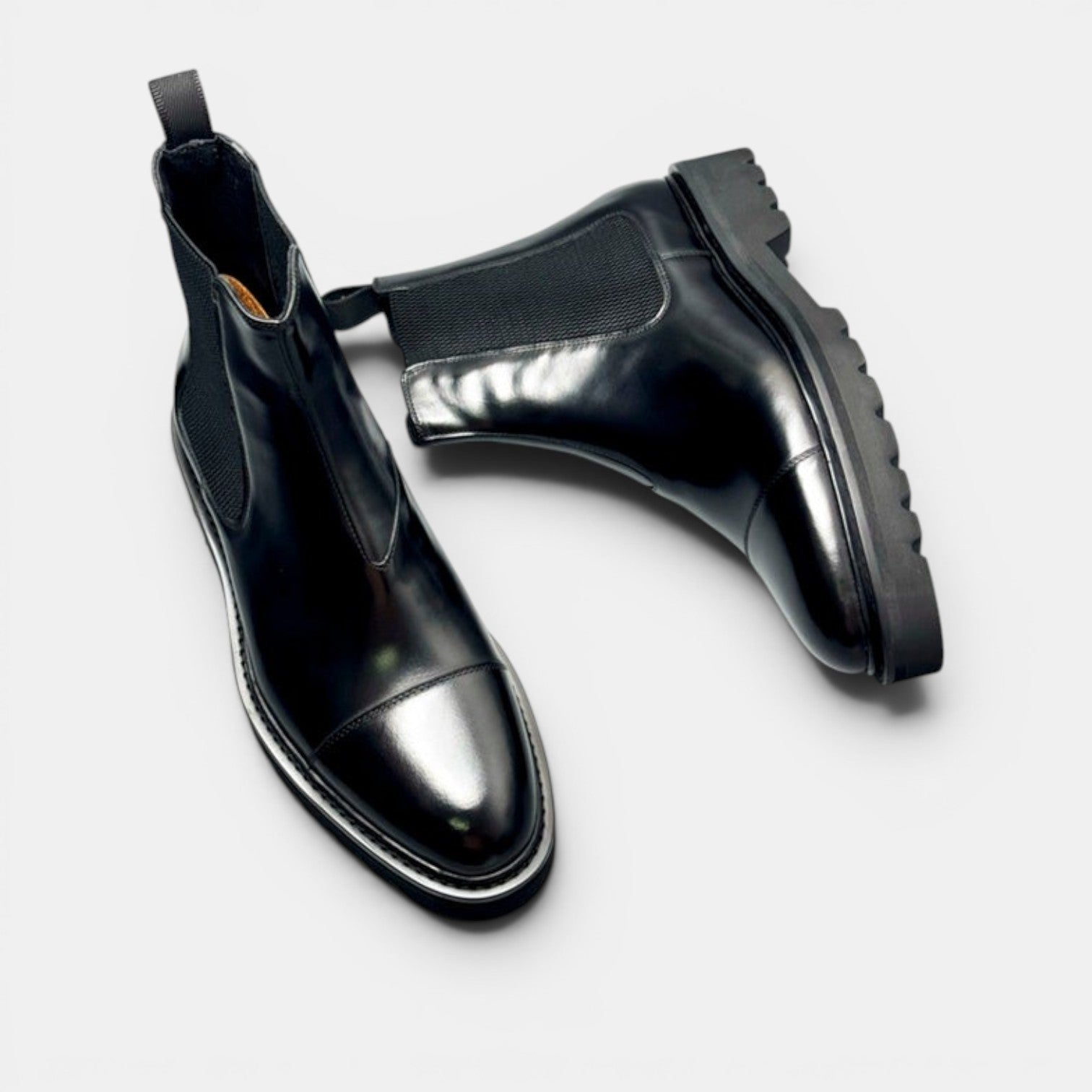 Barcon Getta Inc black leather Chelsea boots with elastic side panels and lug sole.