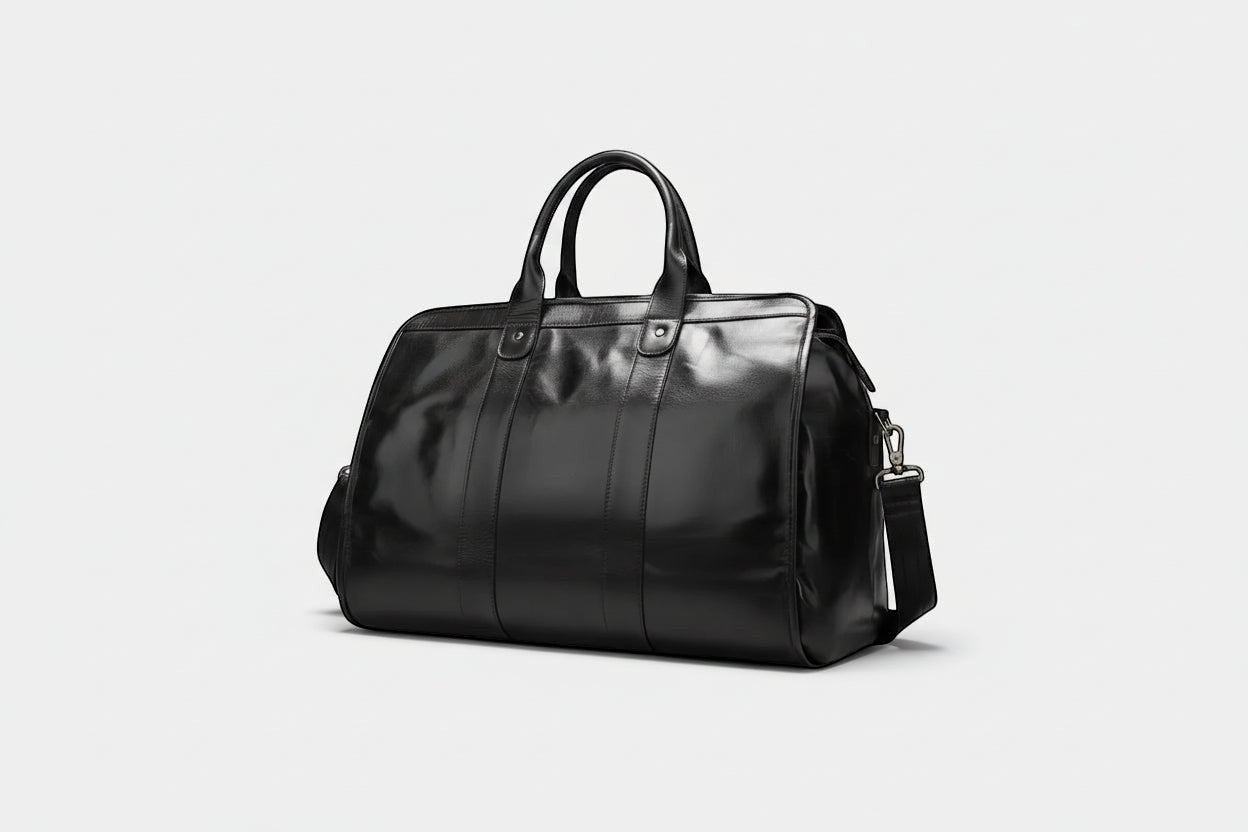 Barcon Getta Inc The Diplomat Duffel, black full grain leather travel bag with comfortable handles and detachable shoulder strap.