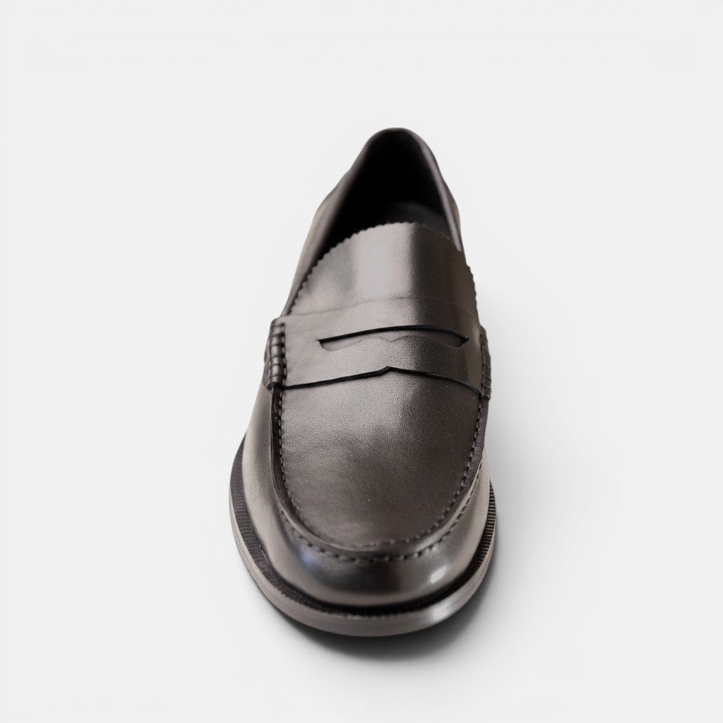 Barcon Getta Inc ABUJA black leather penny loafers with traditional strap detail and stitched accents.