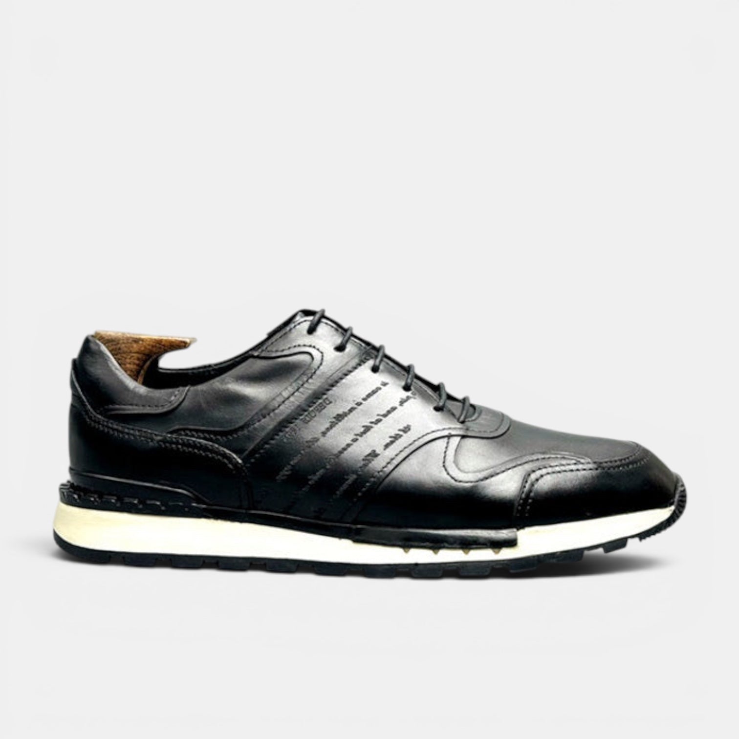 Barcon Getta Inc black full grain leather casual sneakers with cap toe and embossed script on a chunky lug sole.