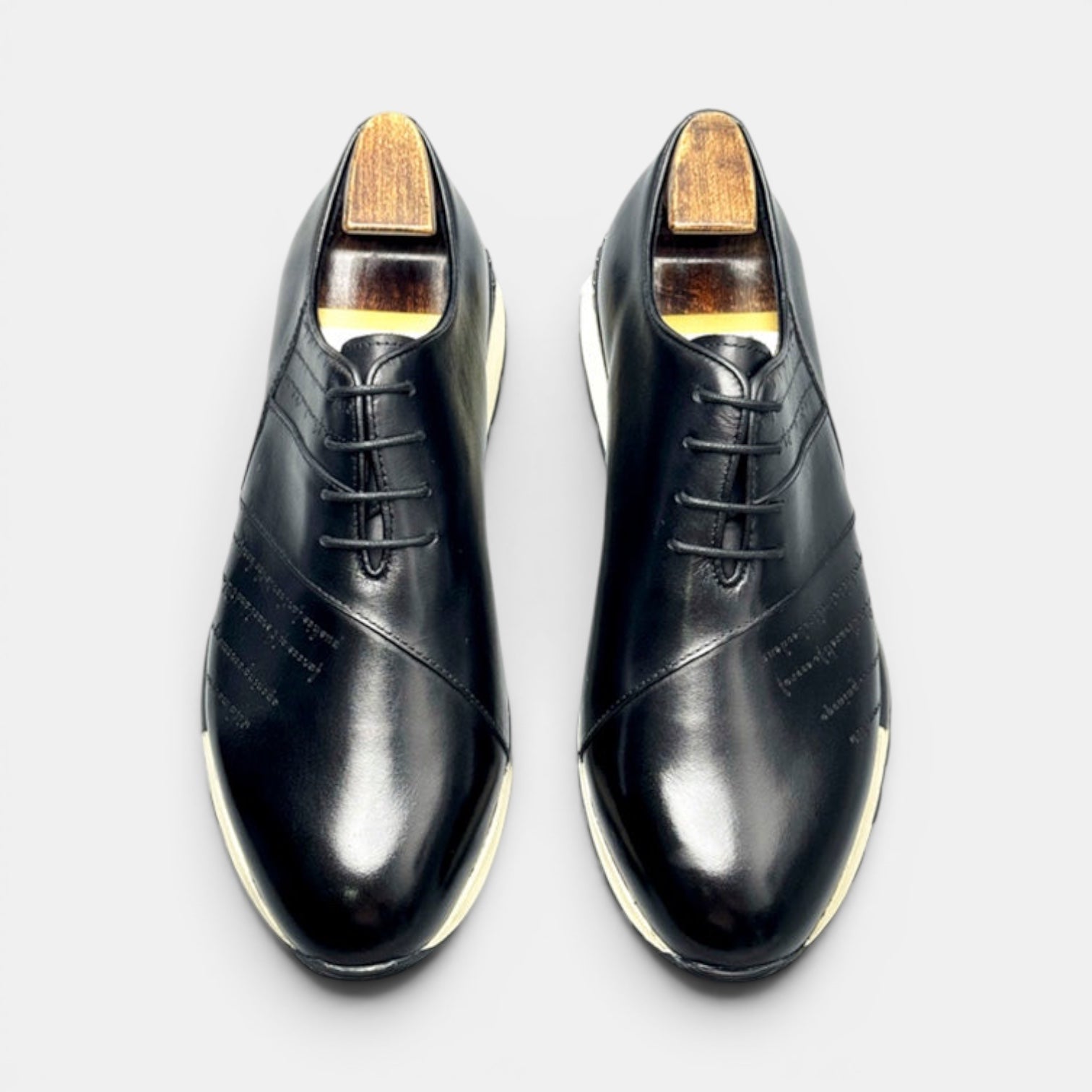 Barcon Getta Inc black full grain leather FREETOWN SHARP sneakers with white EVA midsole and lug sole.