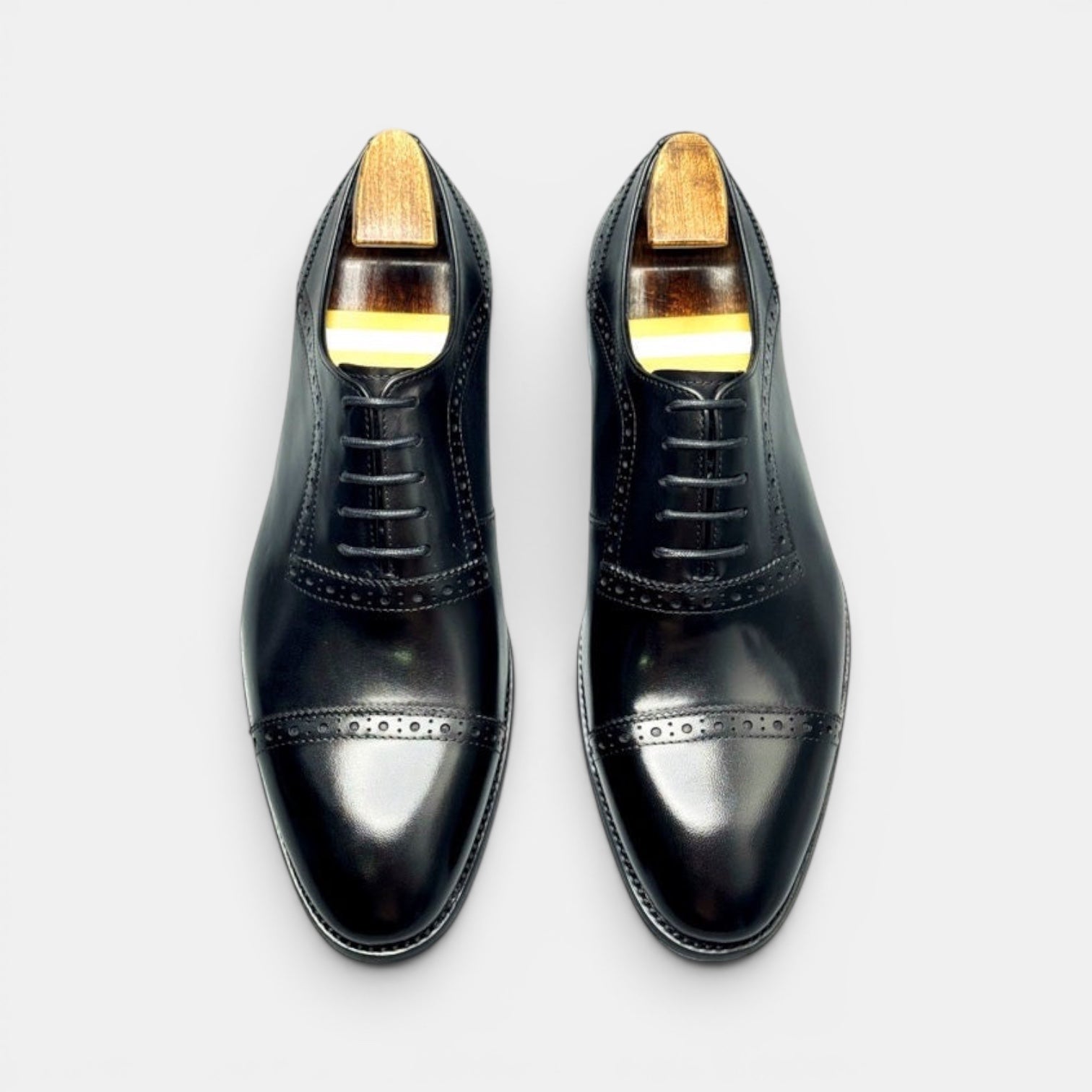 Barcon Getta Inc black full grain leather Oxford cap toe dress shoes with brogue detailing and 4 eyelets.
