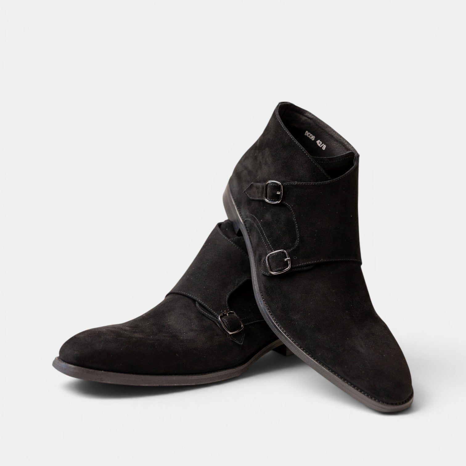 Barcon Getta Inc black suede double monk strap ankle boots with polished buckle closures.