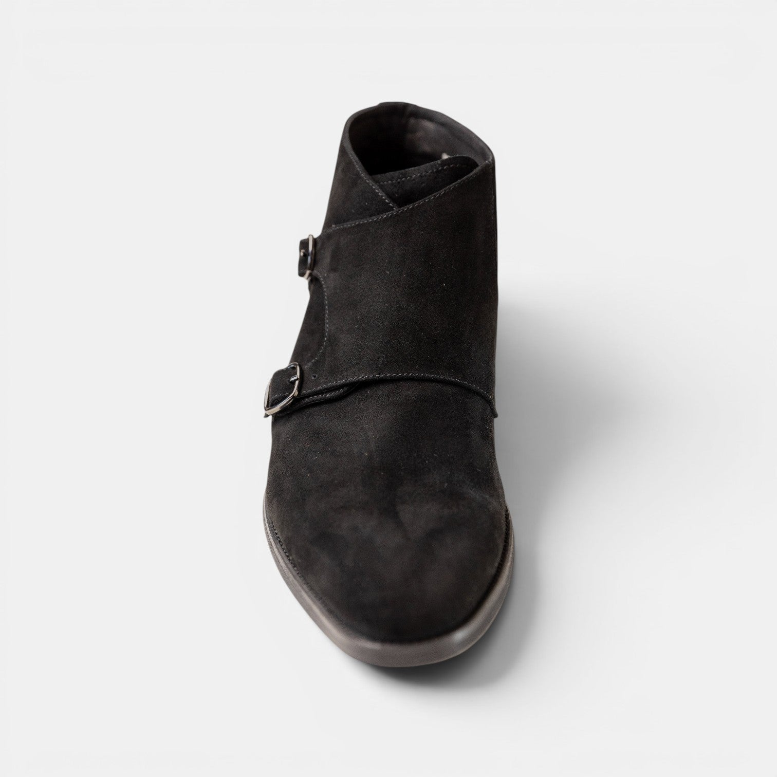Barcon Getta Inc black suede double monk strap ankle boots with polished buckle closures.