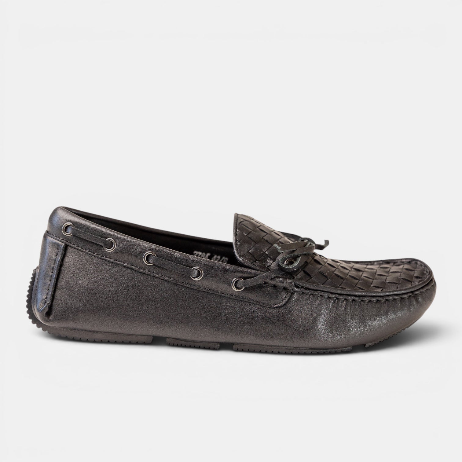 Barcon Getta Inc black full grain leather woven driving moccasins with a lace-through bow and gunmetal eyelets.
