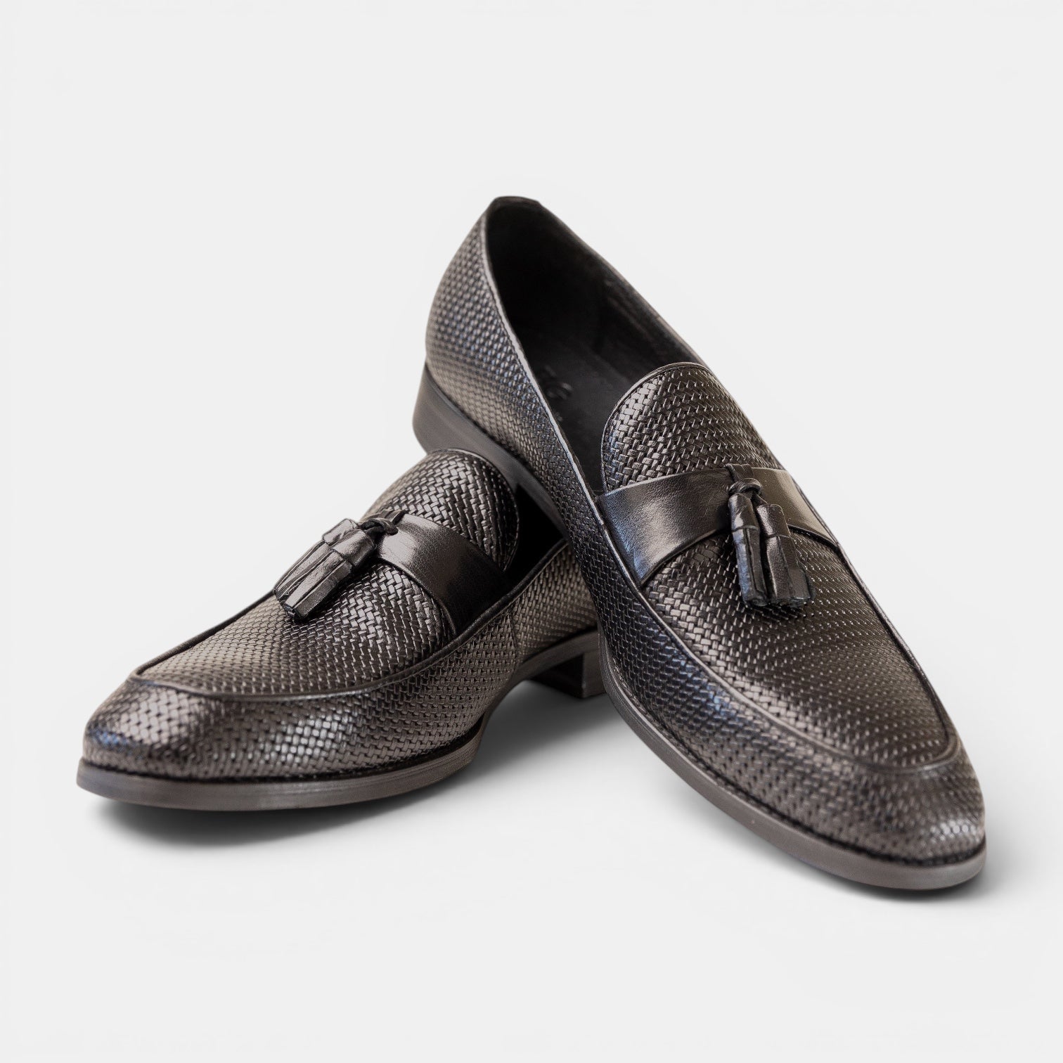 Barcon Getta Inc BERBERA black woven leather tassel loafers with smooth leather strap.