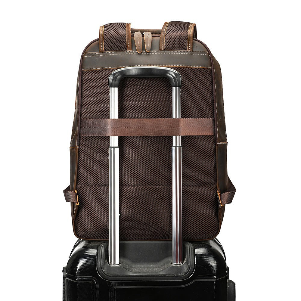Barcon Getta Inc brown leather backpack with breathable mesh back and luggage strap, fits up to 16" laptop.