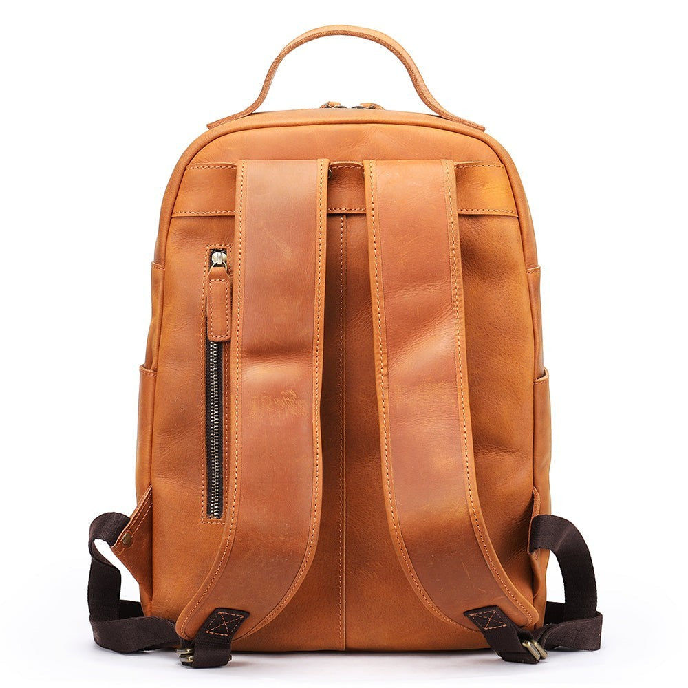 Barcon Getta Inc brown genuine leather backpack with adjustable padded straps and zippered pocket.