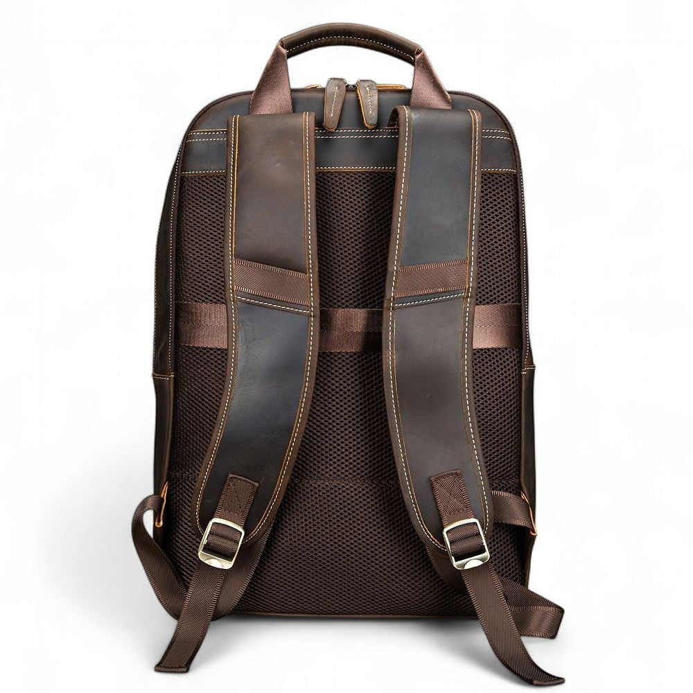 Barcon Getta Inc brown leather backpack with breathable mesh back and padded straps. Fits up to 16" laptop.