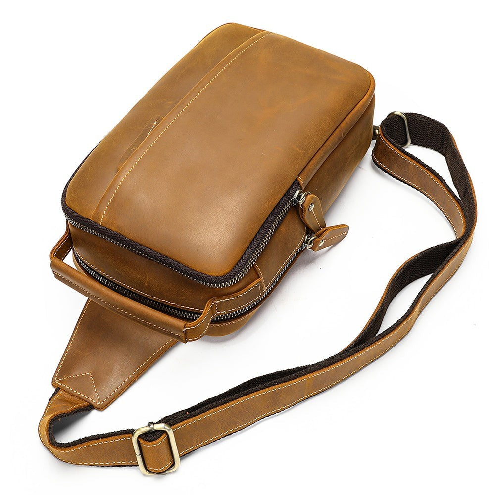 Barcon Getta Inc MERIDIAN brown genuine leather cross-body bag with zippered compartments and adjustable strap.