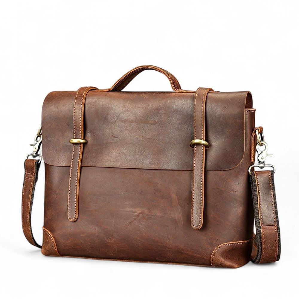 Barcon Getta Inc brown full grain leather messenger bag with adjustable strap and brass hardware. Fits up to 16" laptop.