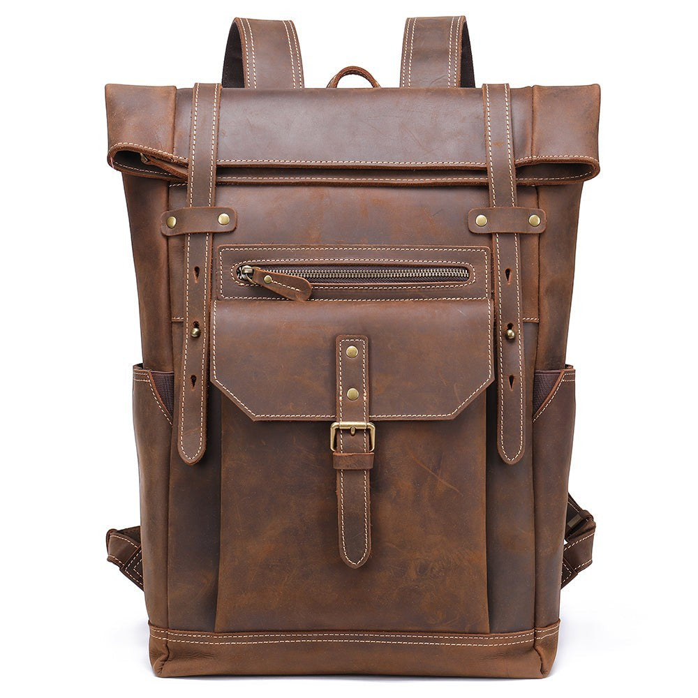 Barcon Getta Inc NOMAD brown leather roll-top backpack with buckle closure, front zipper pocket, and side pockets. Handmade.