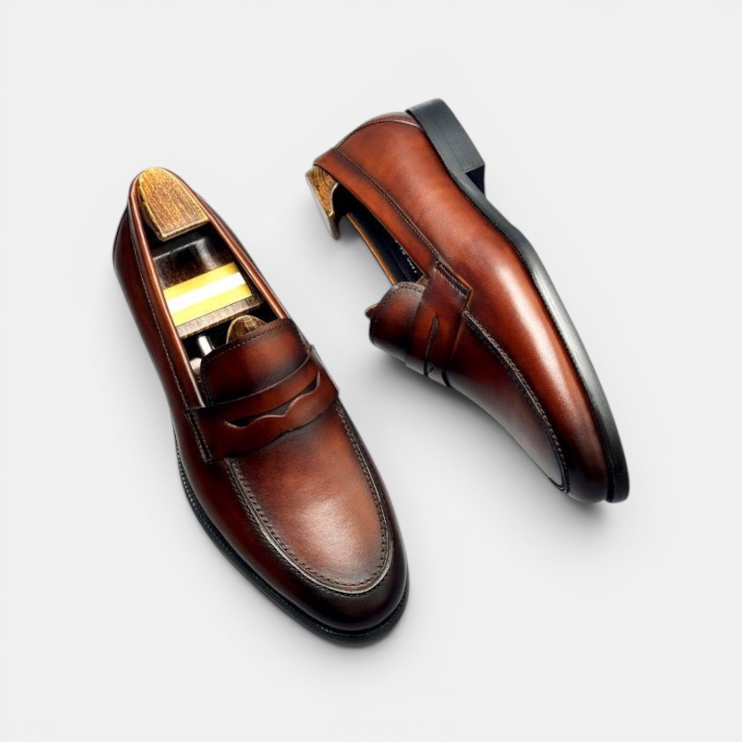 Barcon Getta Inc BANGUI Penny Loafer in rich brown polished leather with classic vamp strap detail.