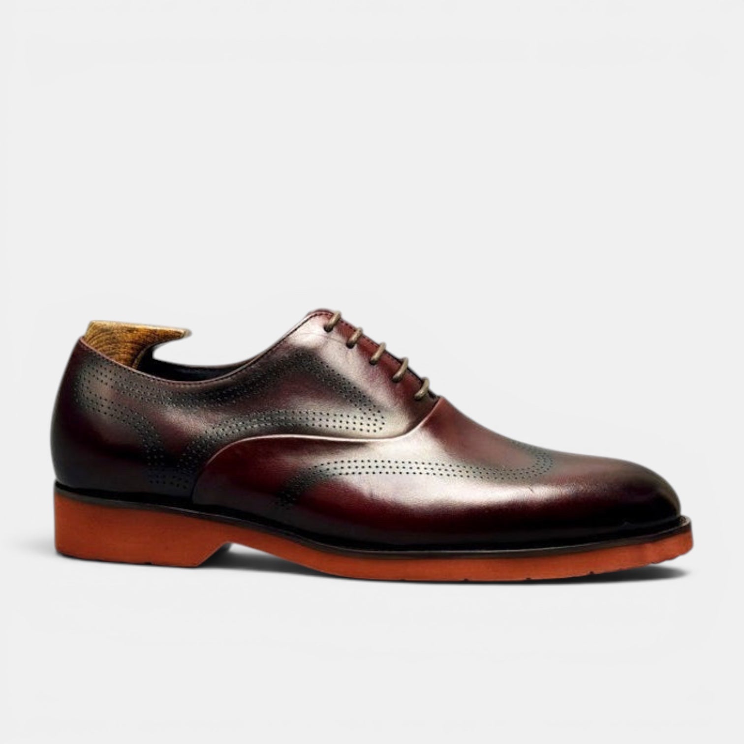 Barcon Getta Inc. burgundy leather wingtip brogue Oxford dress shoes with burnt orange sole.