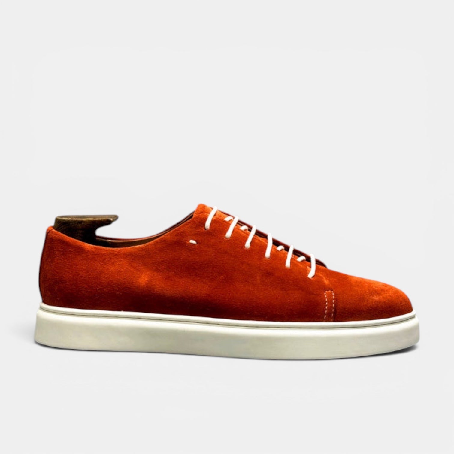 Barcon Getta Inc MEDA LOW TOP SUEDE sneaker in burnt orange suede with white laces and white sole. Cap toe detail.