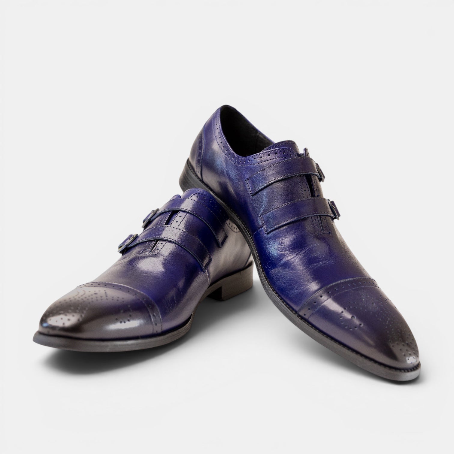 Barcon Getta Inc CAIRO cobalt blue leather double monk strap dress shoes with brogue details and gold buckles.
