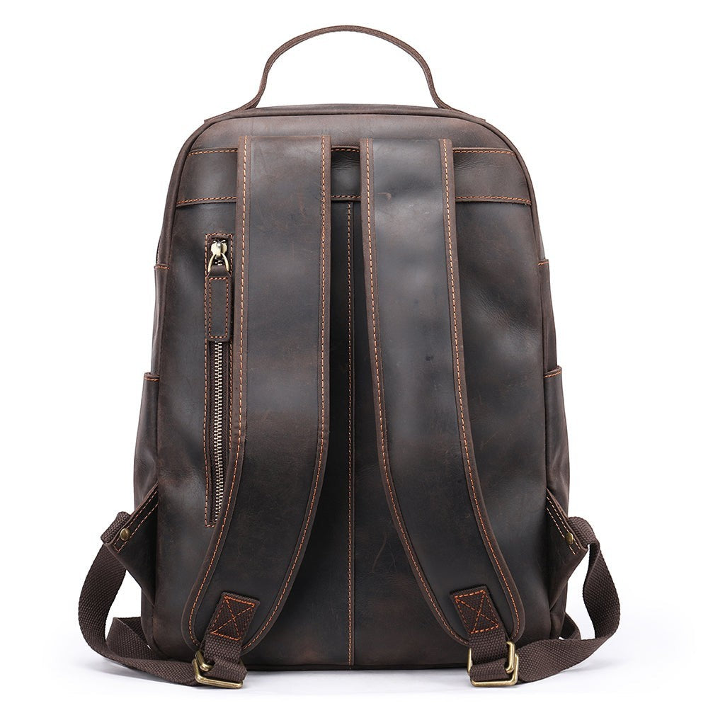 Barcon Getta Inc dark brown genuine leather backpack with adjustable padded straps and zippered pocket.